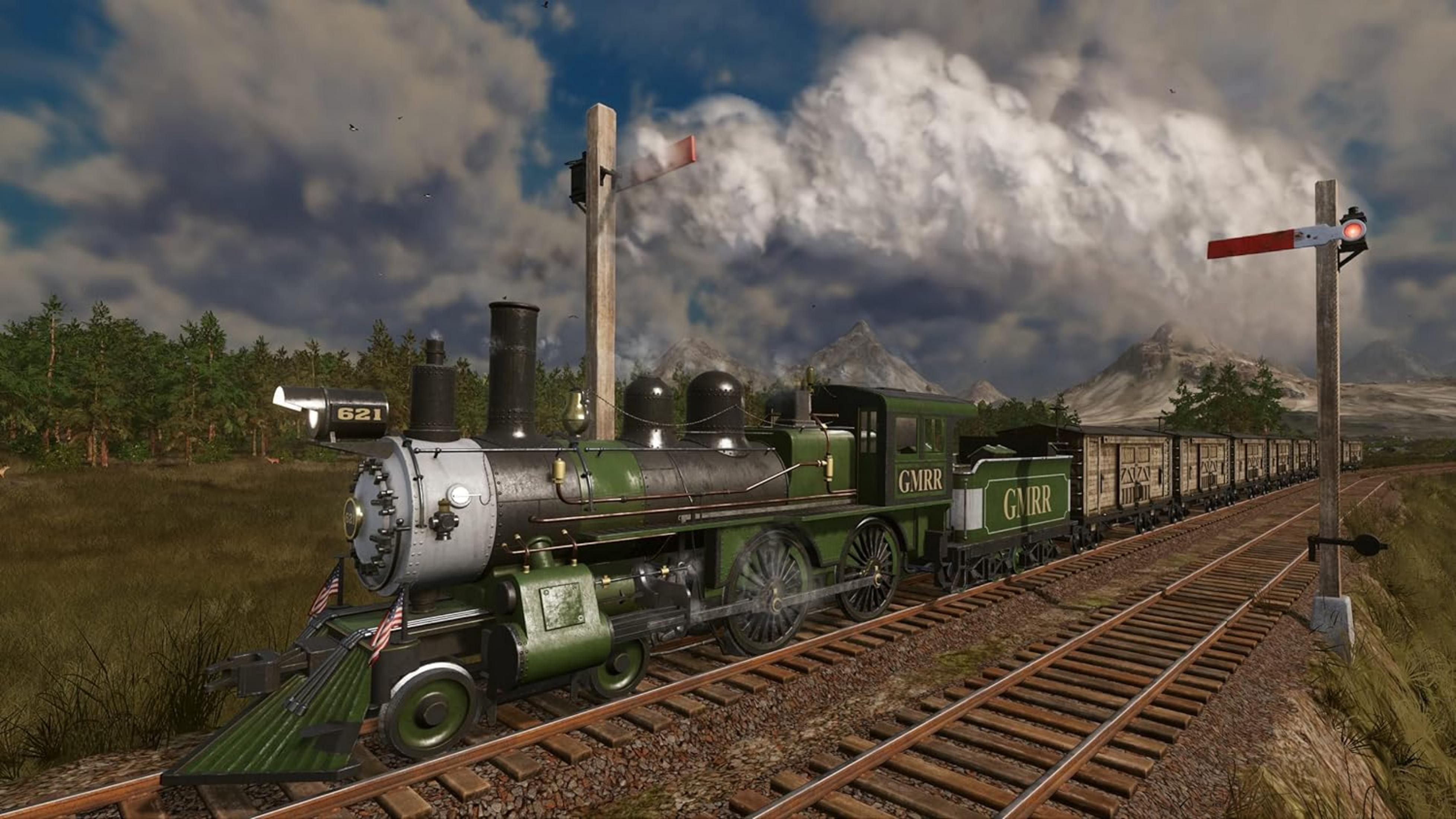 Una locomotiva a vapore verde con vagoni viaggia sui binari in un paesaggio collinare.