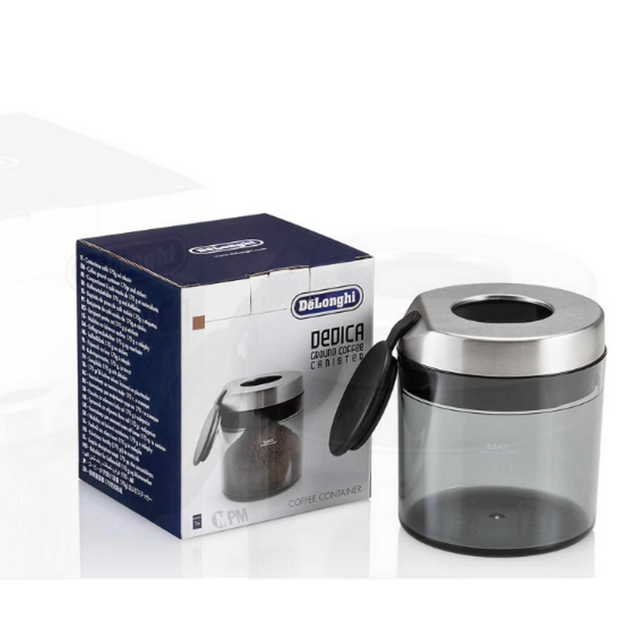 Contenedor de café DeLonghi Dedica con tapa y cuchara, caja al lado.