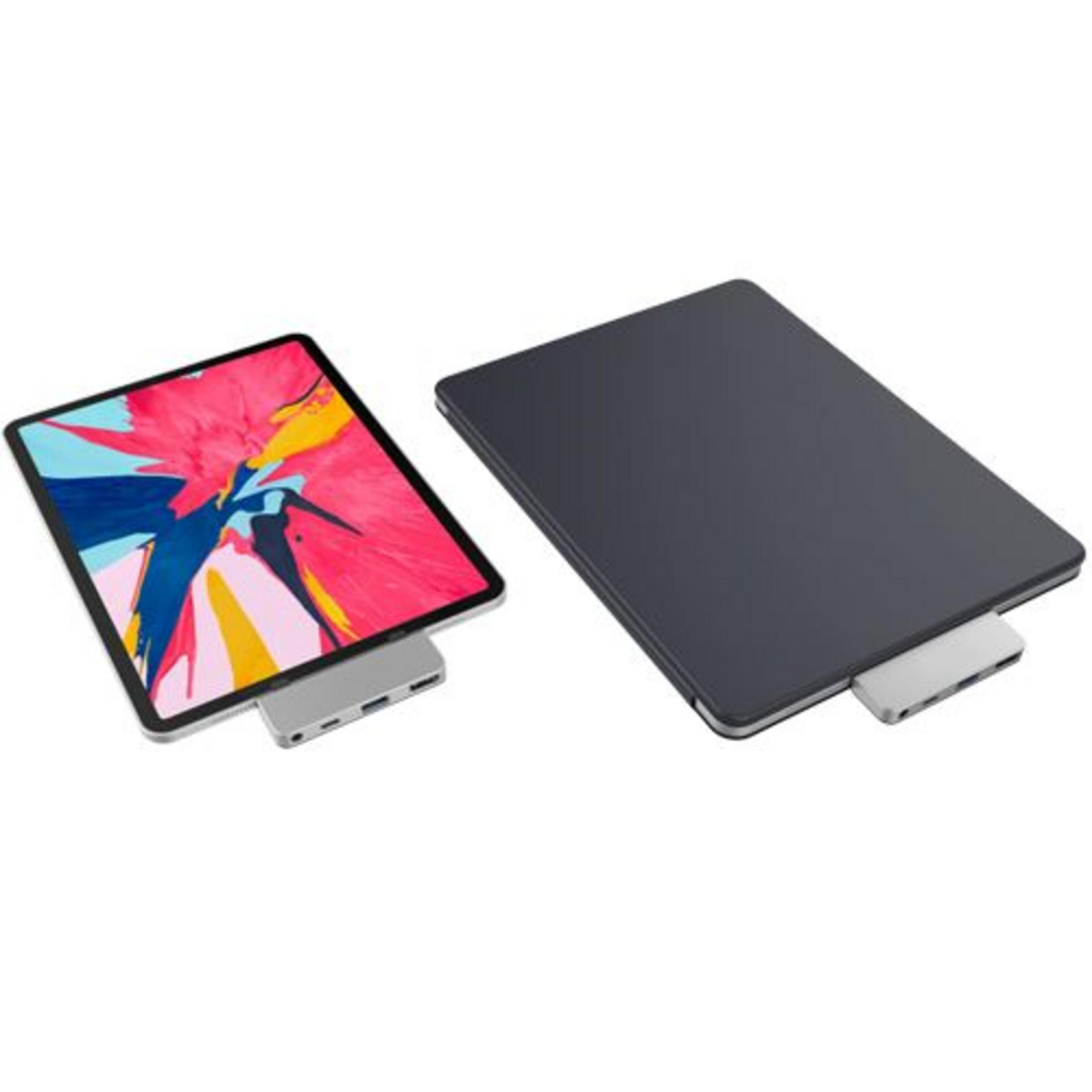 Dos tabletas con hubs grises. Una muestra un gráfico abstracto colorido.
