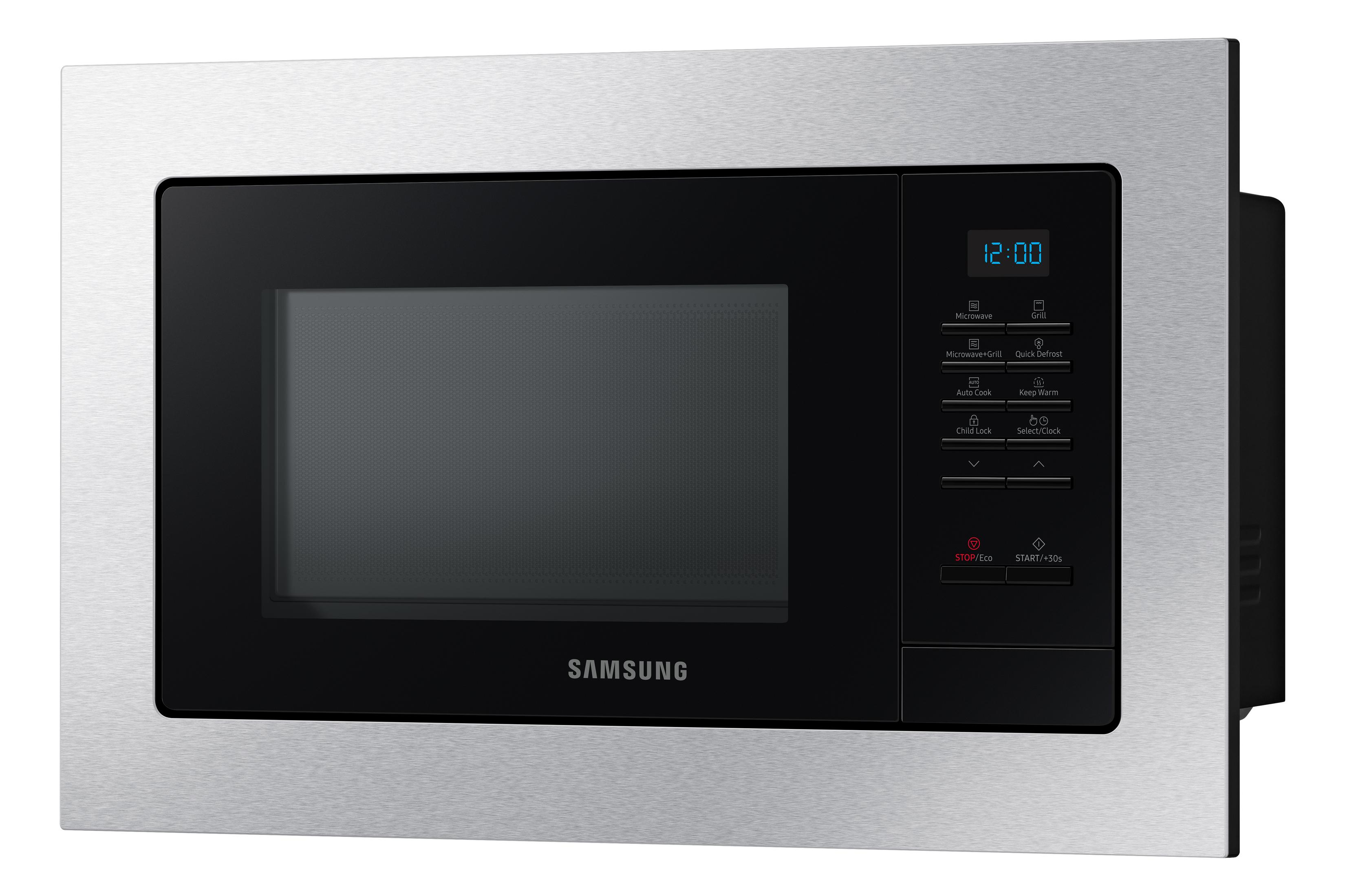 A silver Samsung microwave with a black door and control panel. The clock shows 12:00.