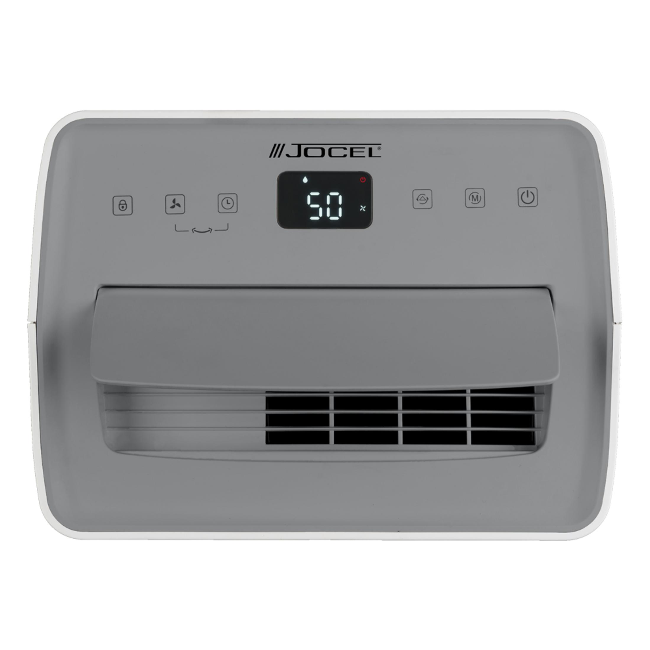 Un deshumidificador gris con pantalla digital y ranuras de ventilación.