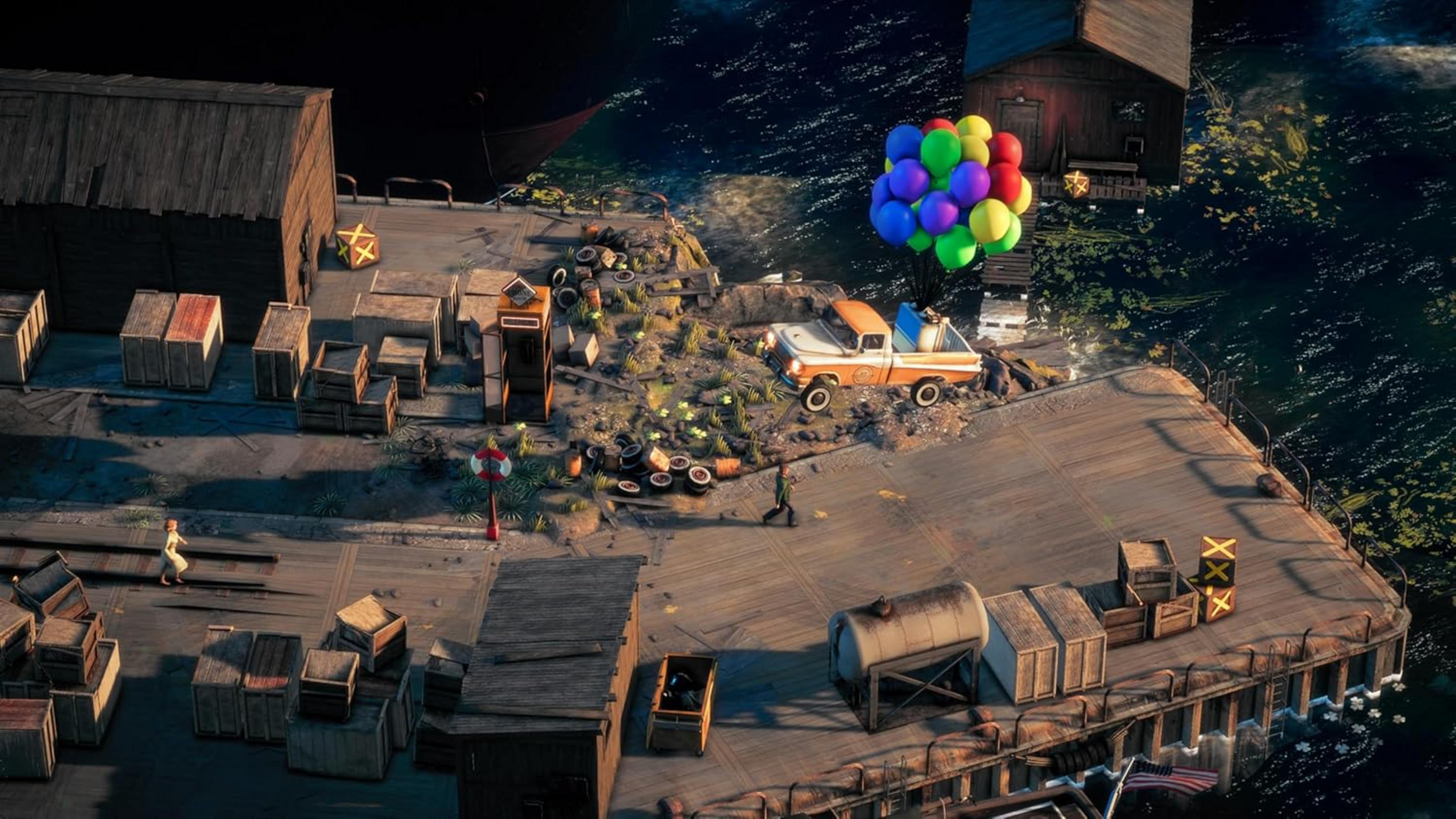 Un camión naranja y blanco con globos de colores flota sobre un muelle con cajas y edificios.