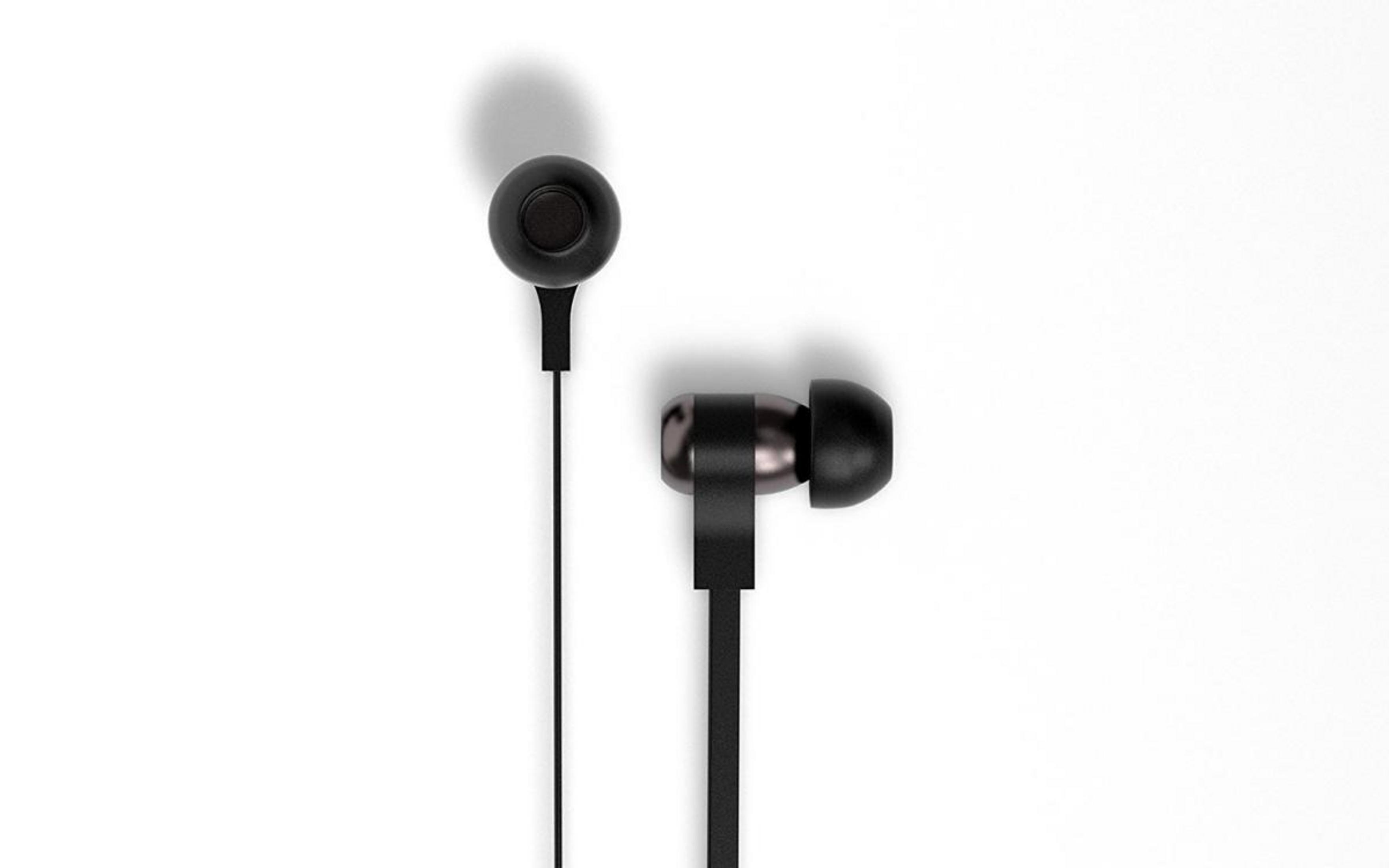 Auricolari neri su sfondo bianco con ombra.