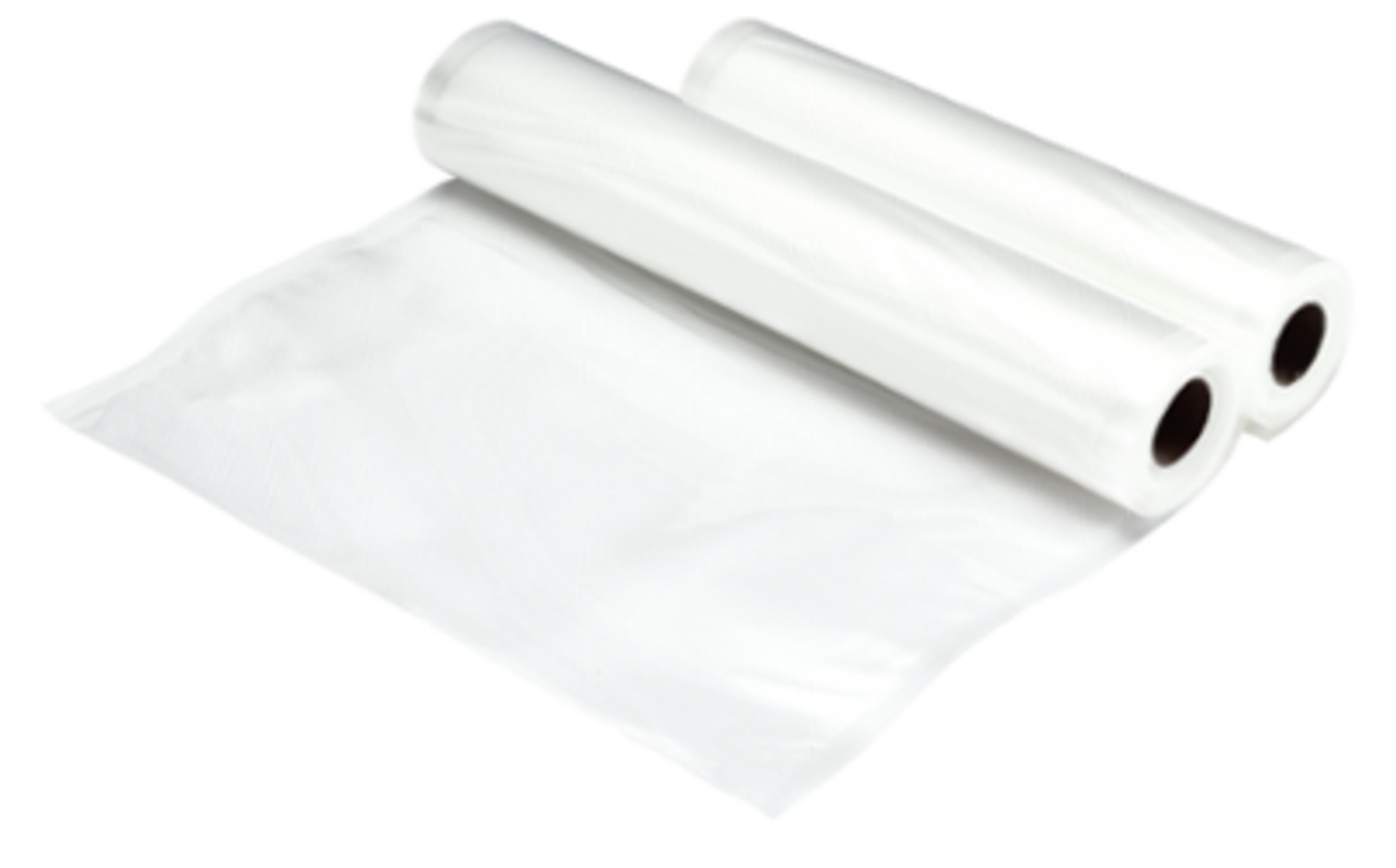 Due rotoli di sacchetti sottovuoto trasparenti giacciono su un foglio di plastica spiegato.