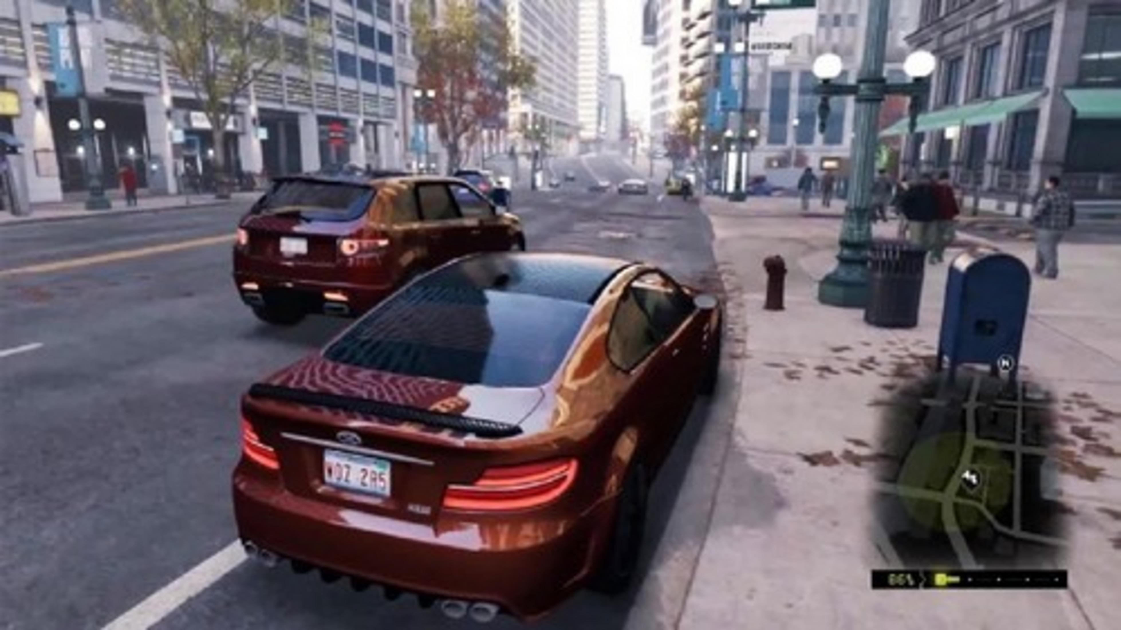 A red sports car parked on a city street next to an SUV. Buildings and pedestrians in the background.