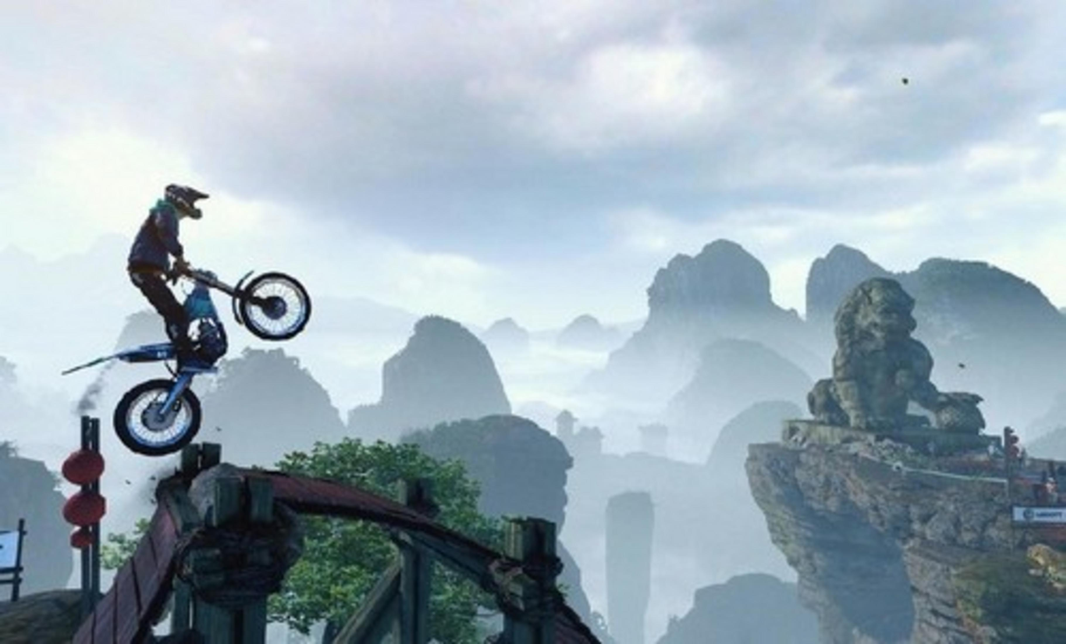 A motorcyclist jumps over a chasm with a stone lion in the background.