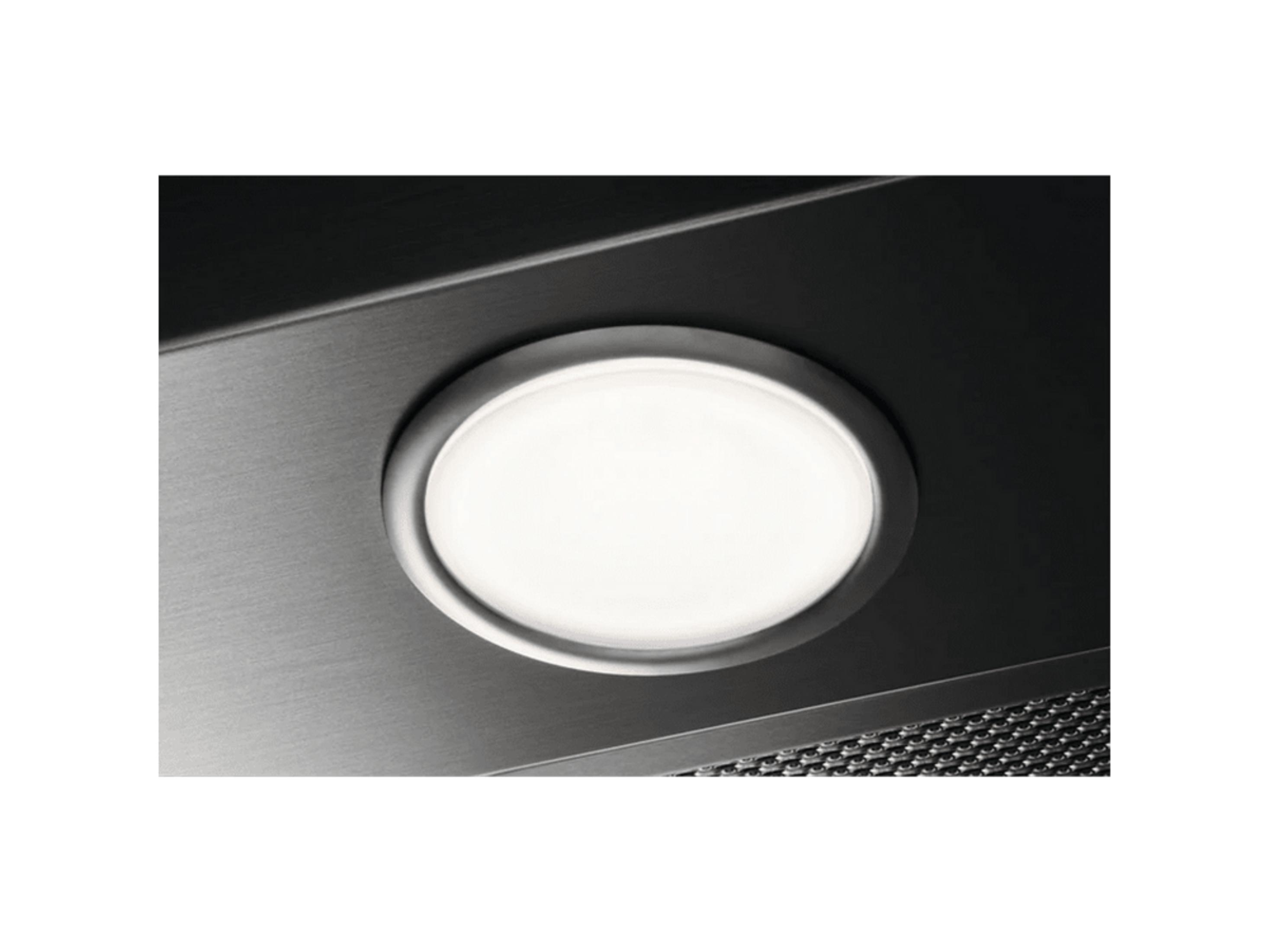 Una luz ovalada brillante está incrustada en una superficie de metal cepillado.