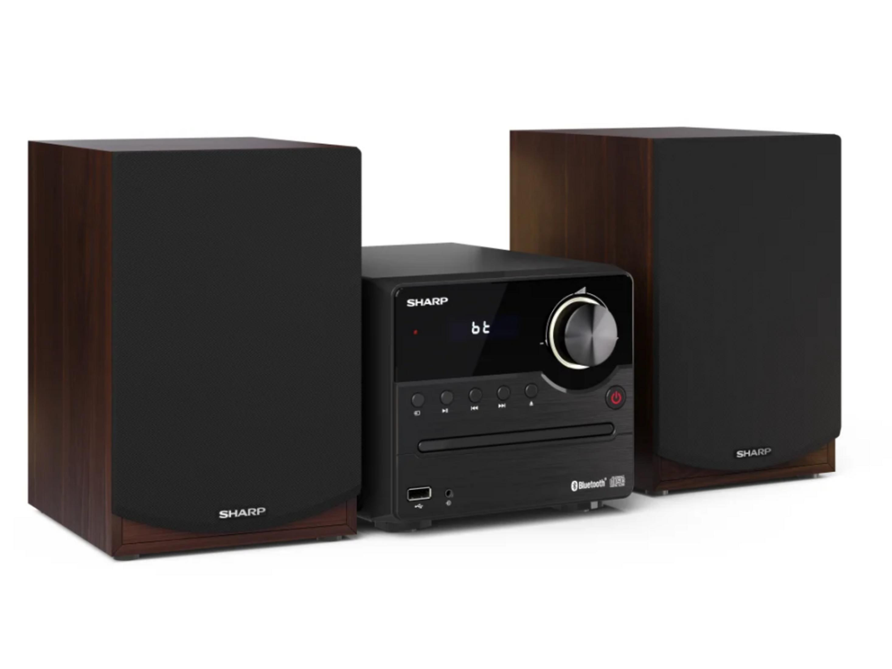Un lettore CD Sharp con due altoparlanti effetto legno e frontali in tessuto nero.