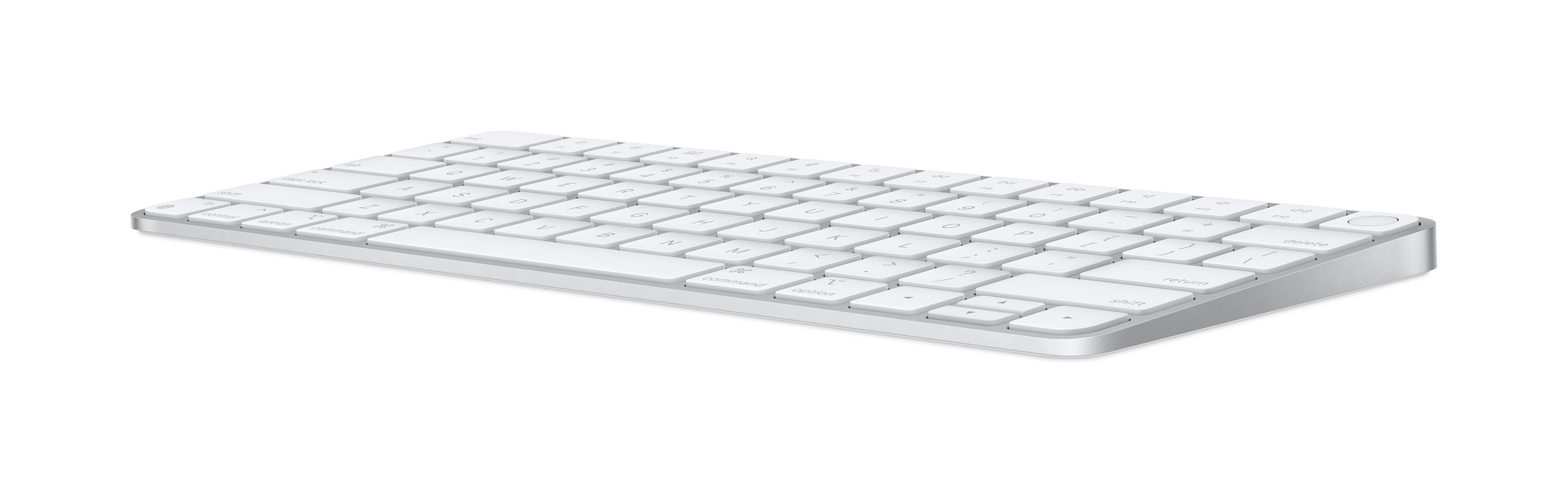 Un teclado blanco con borde plateado sobre fondo blanco.
