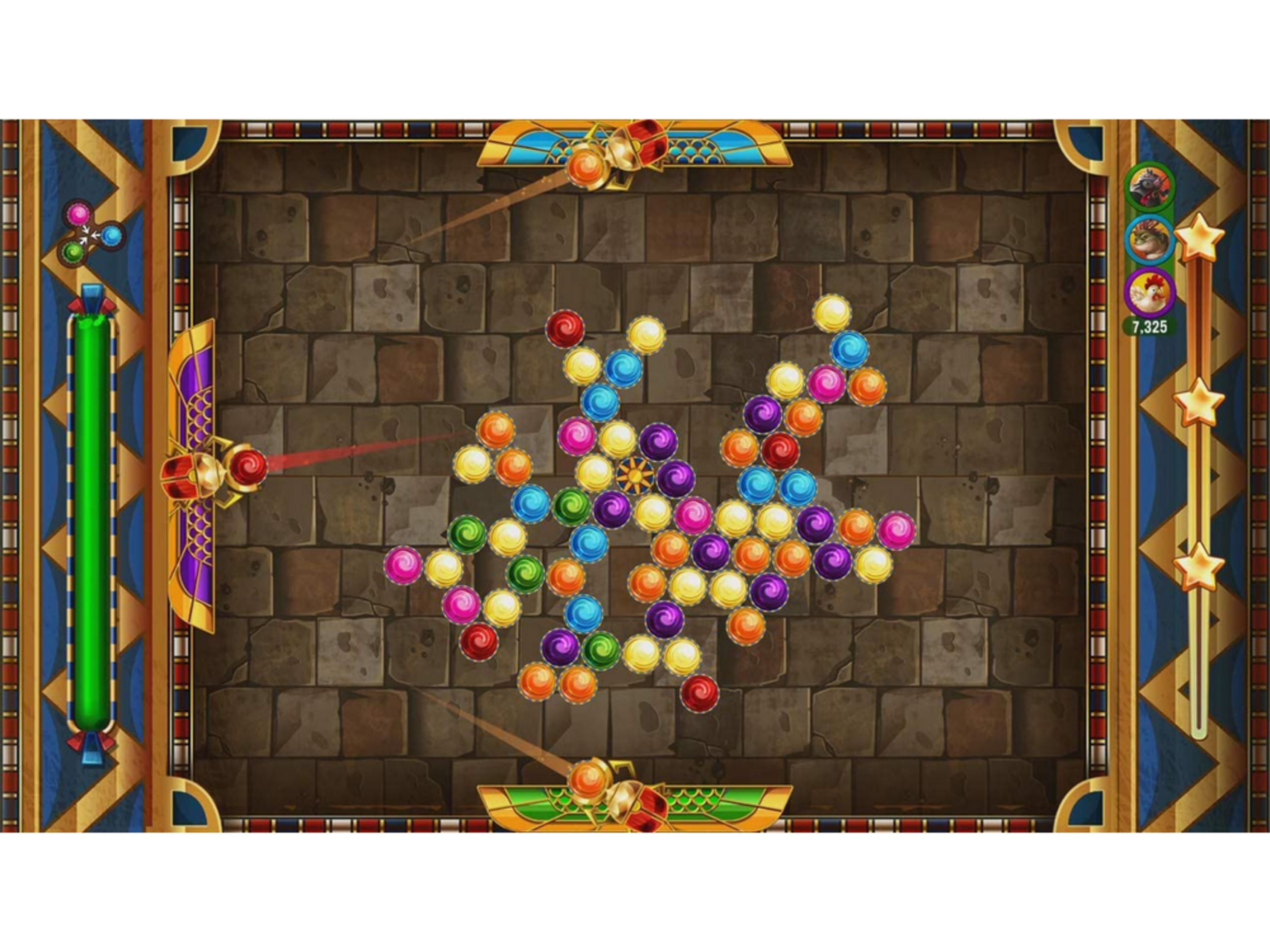 Una schermata di gioco mostra palline colorate sparate contro un muro di pietra.