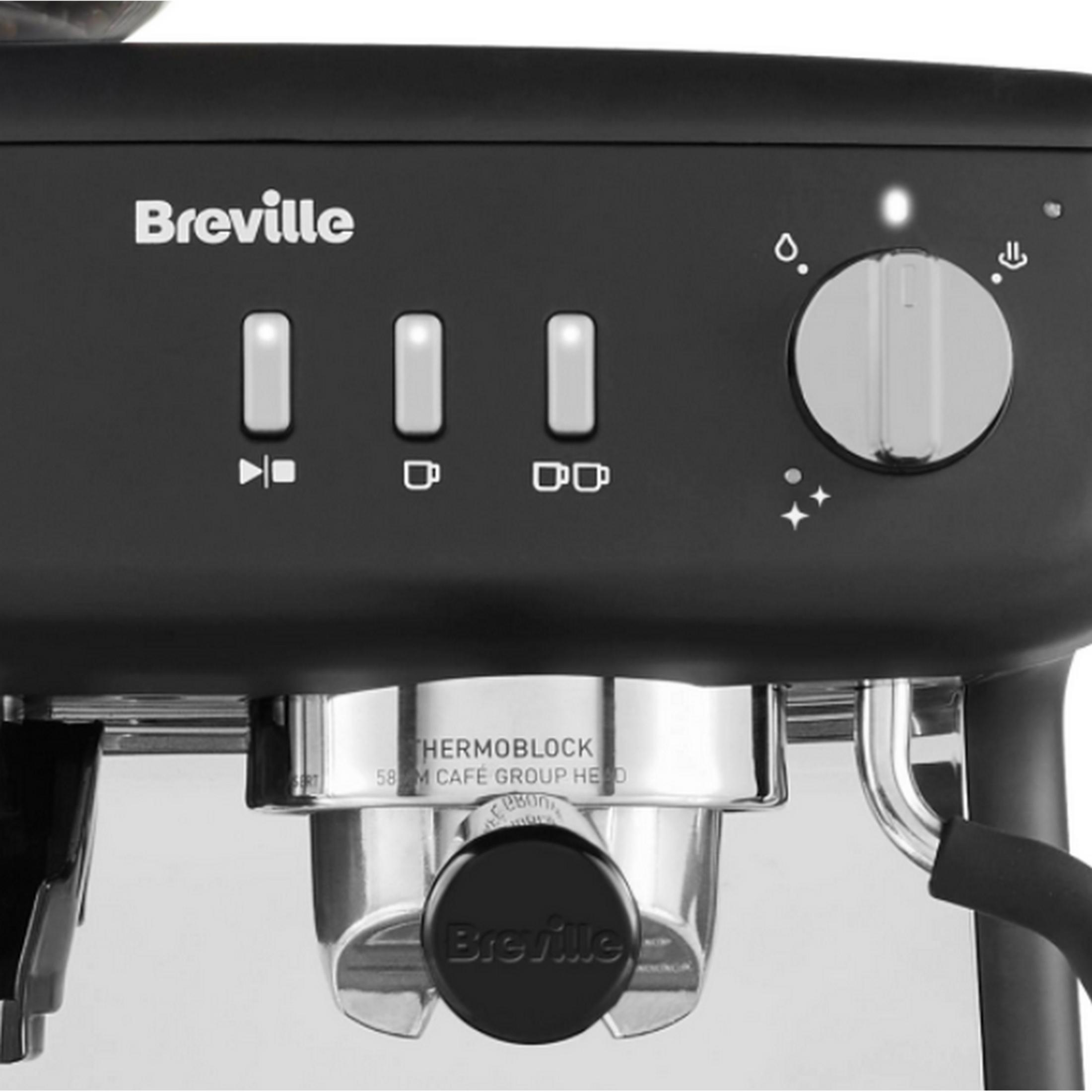 Panel de control de máquina de café Breville con botones, dial y portafiltro.