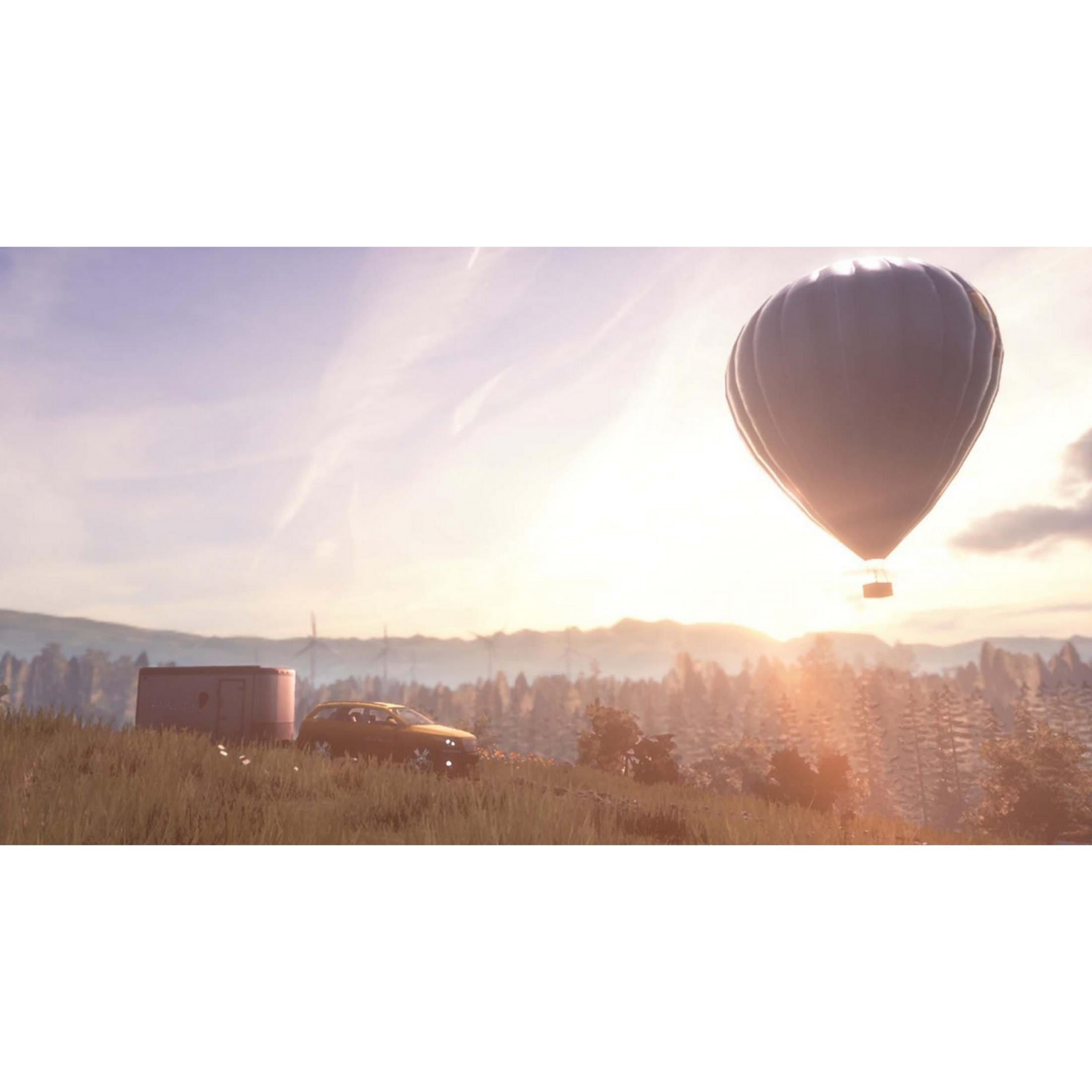 Una mongolfiera fluttua su un paesaggio con un'auto e un edificio.