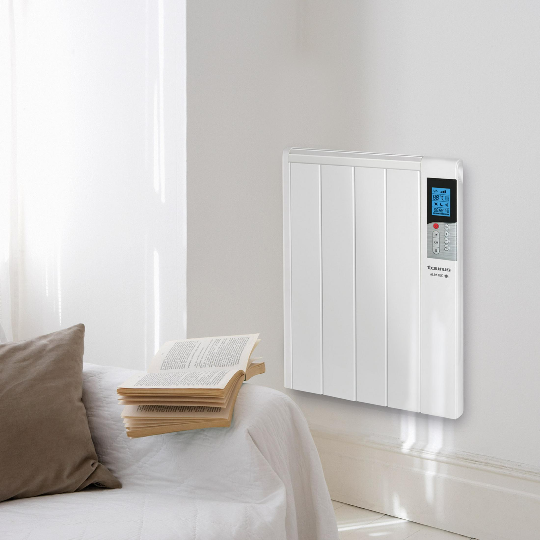 Un termosifone bianco appeso a una parete sopra un letto con cuscino e libro aperto.