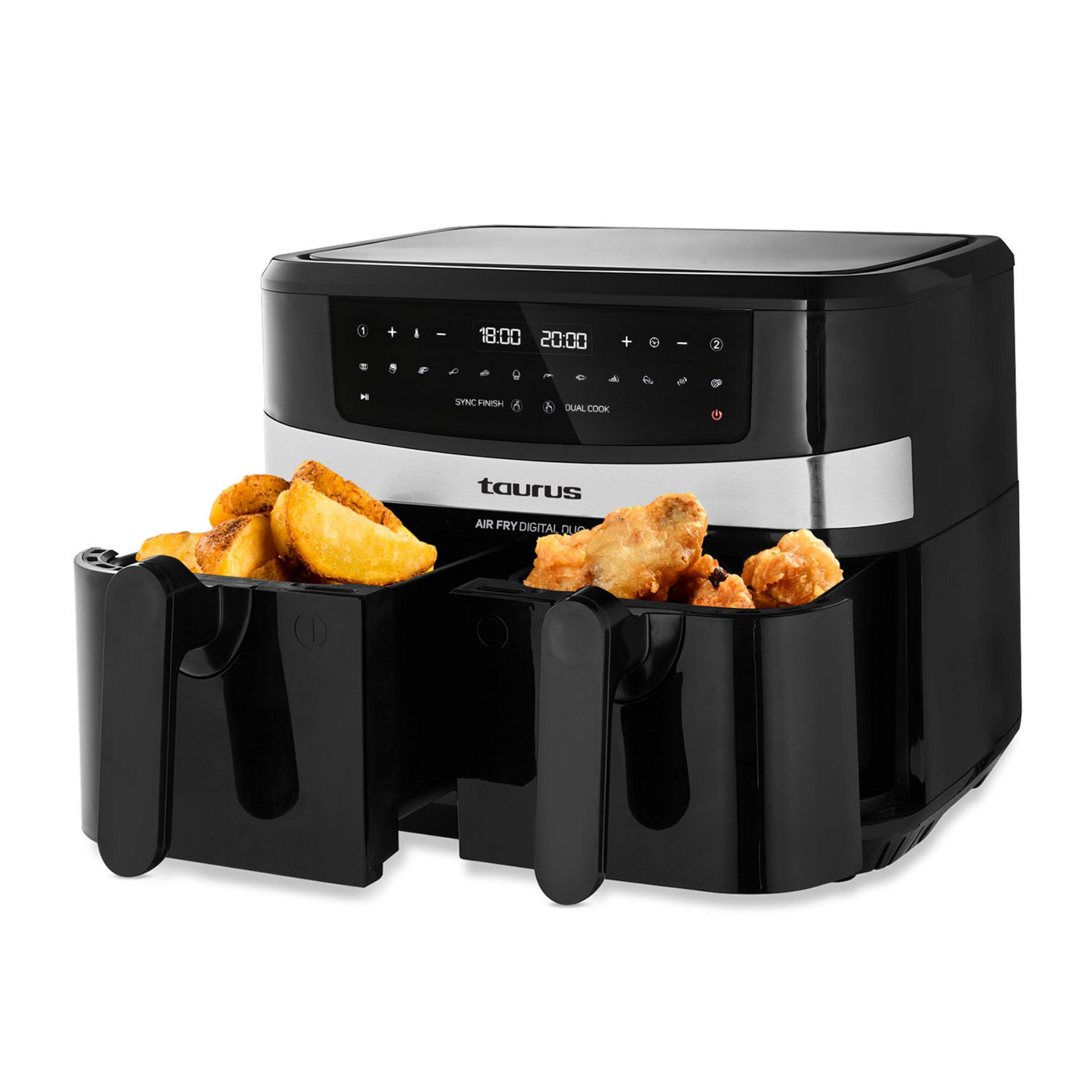 Black dual air fryer filled with french fries and fried chicken pieces.
