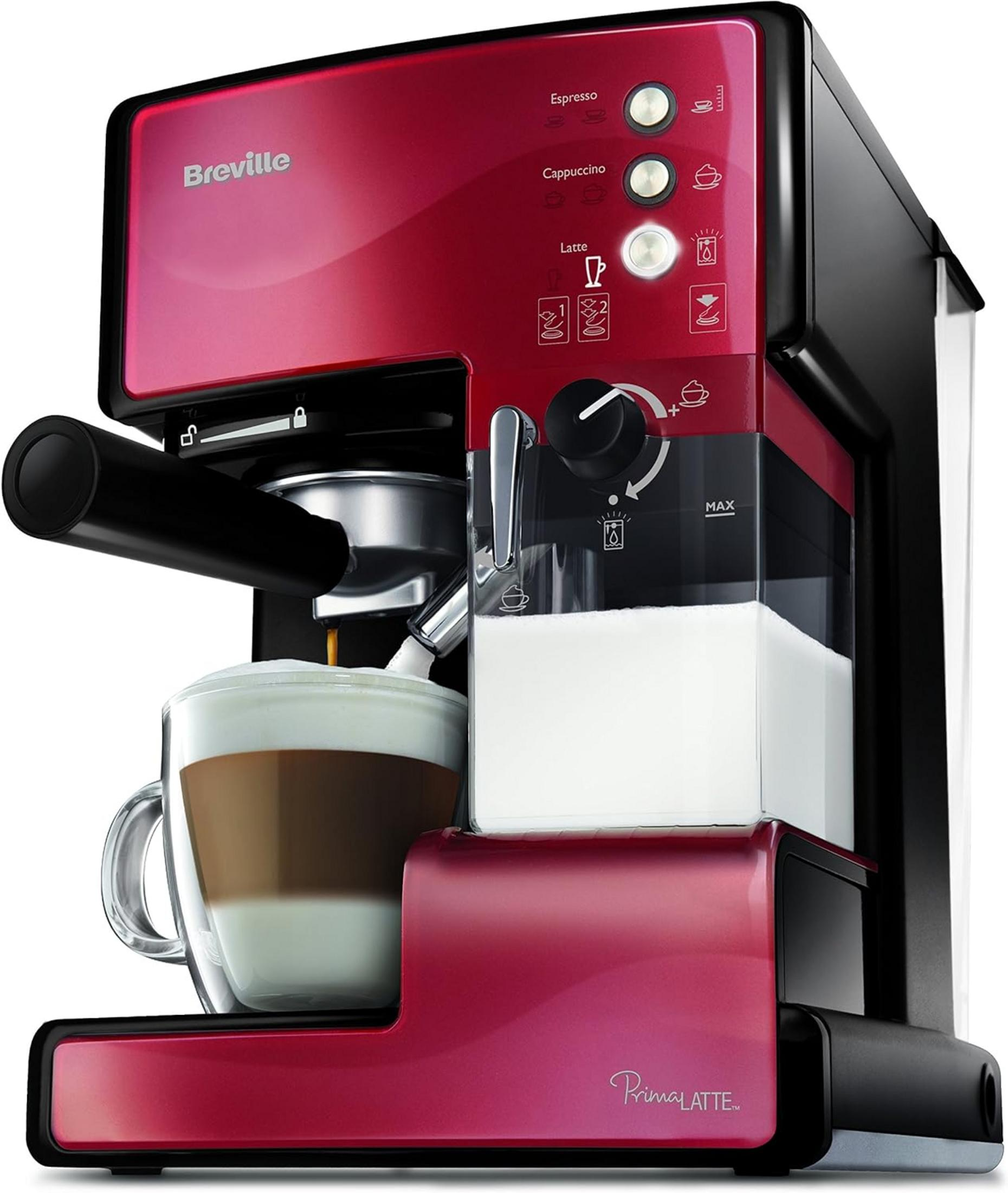 Una cafetera Breville roja con jarra de leche y vaso de latte.