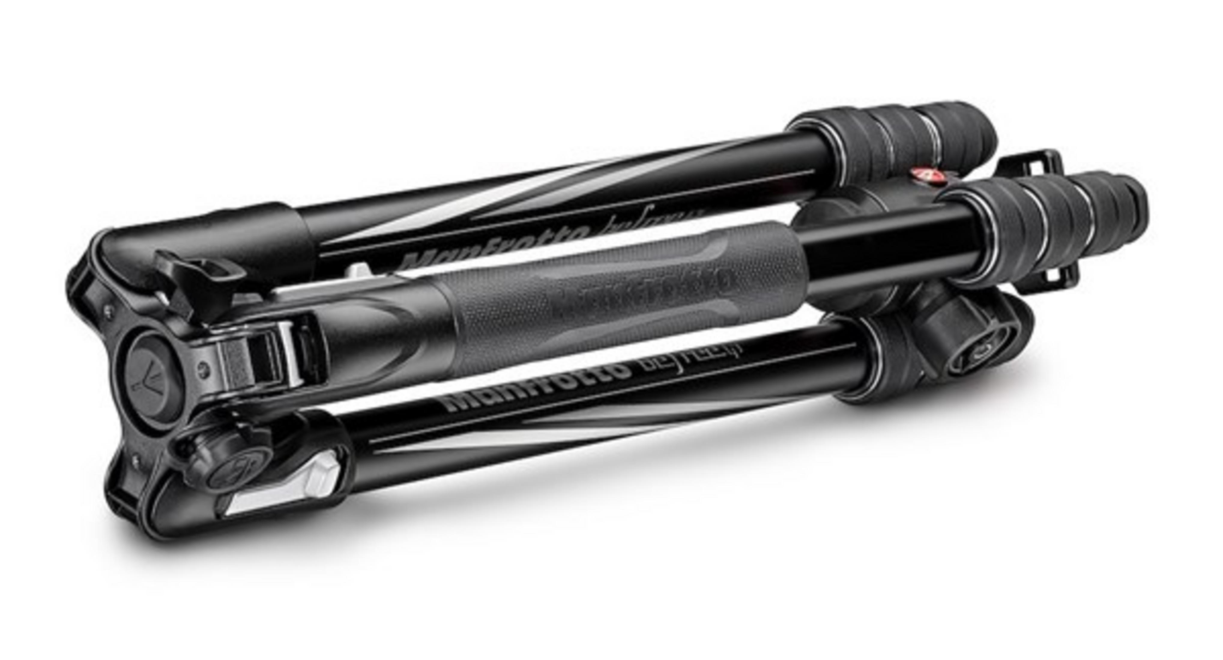 A folded black Manfrotto tripod with aluminum legs and rubber grips.
