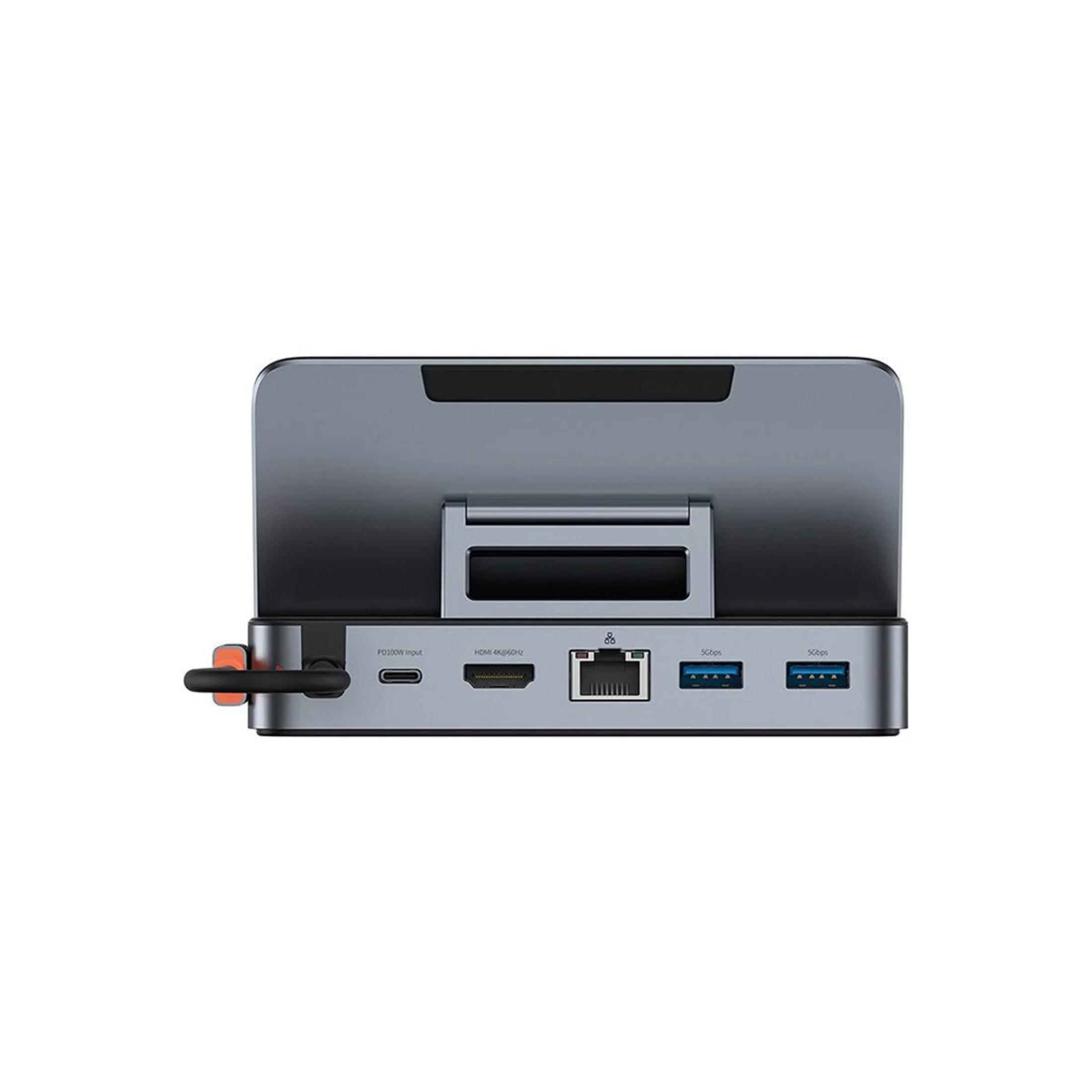 Soporte de acoplamiento gris con puertos USB-C, HDMI, Ethernet y USB-A.
