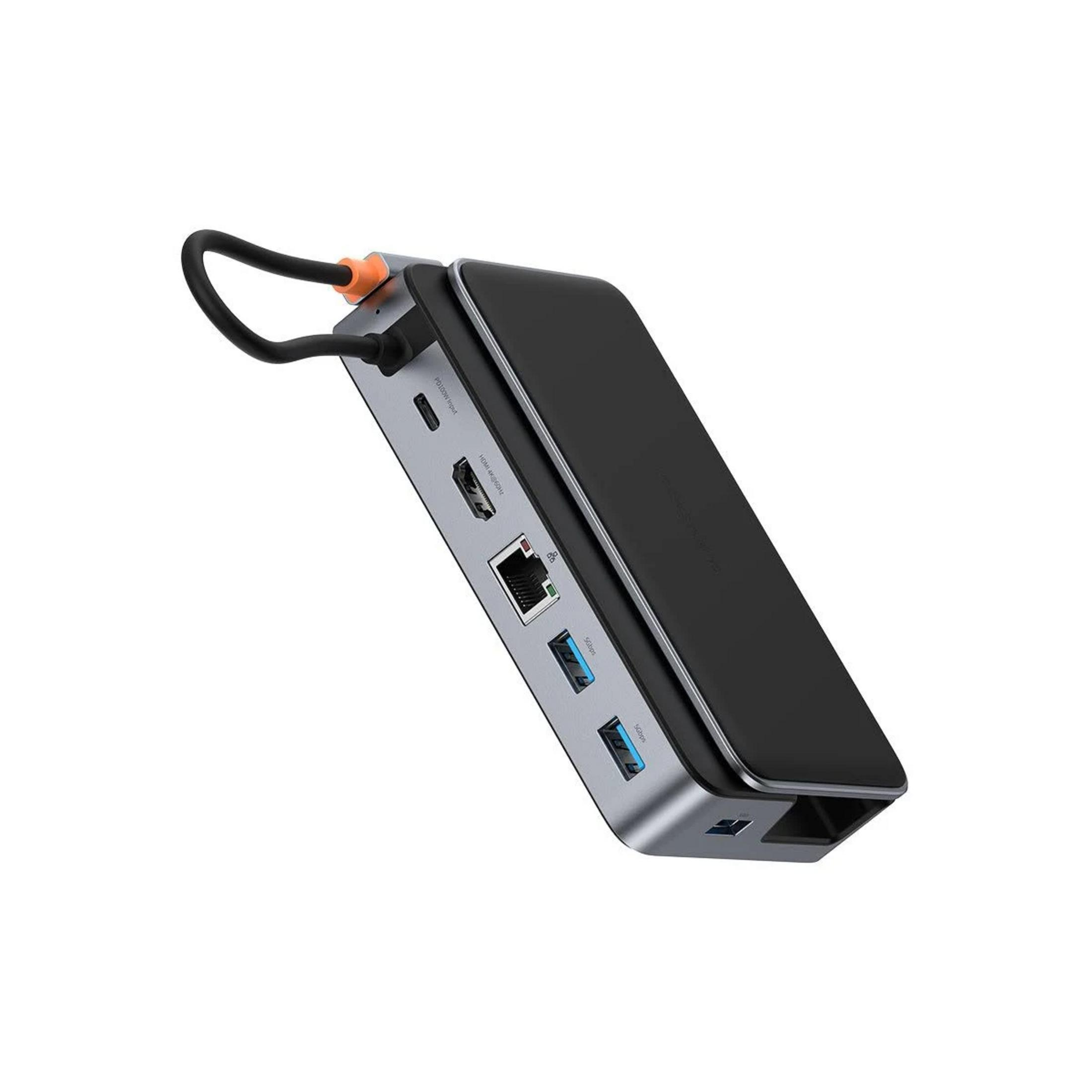 Un concentrador USB-C gris con detalles en negro y plateado, con puertos HDMI, Ethernet y USB.