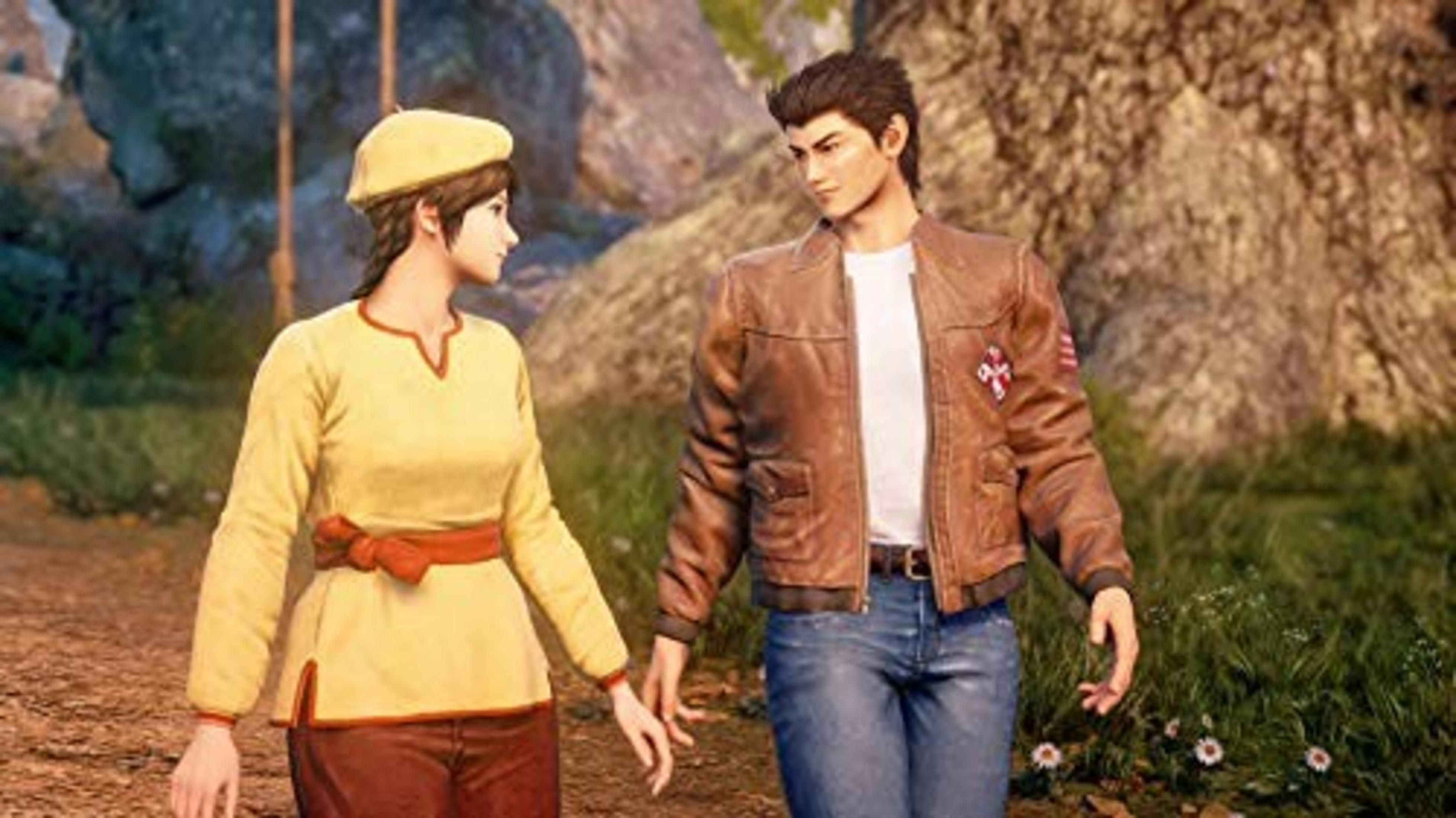 Un uomo e una donna camminano mano nella mano in un campo.