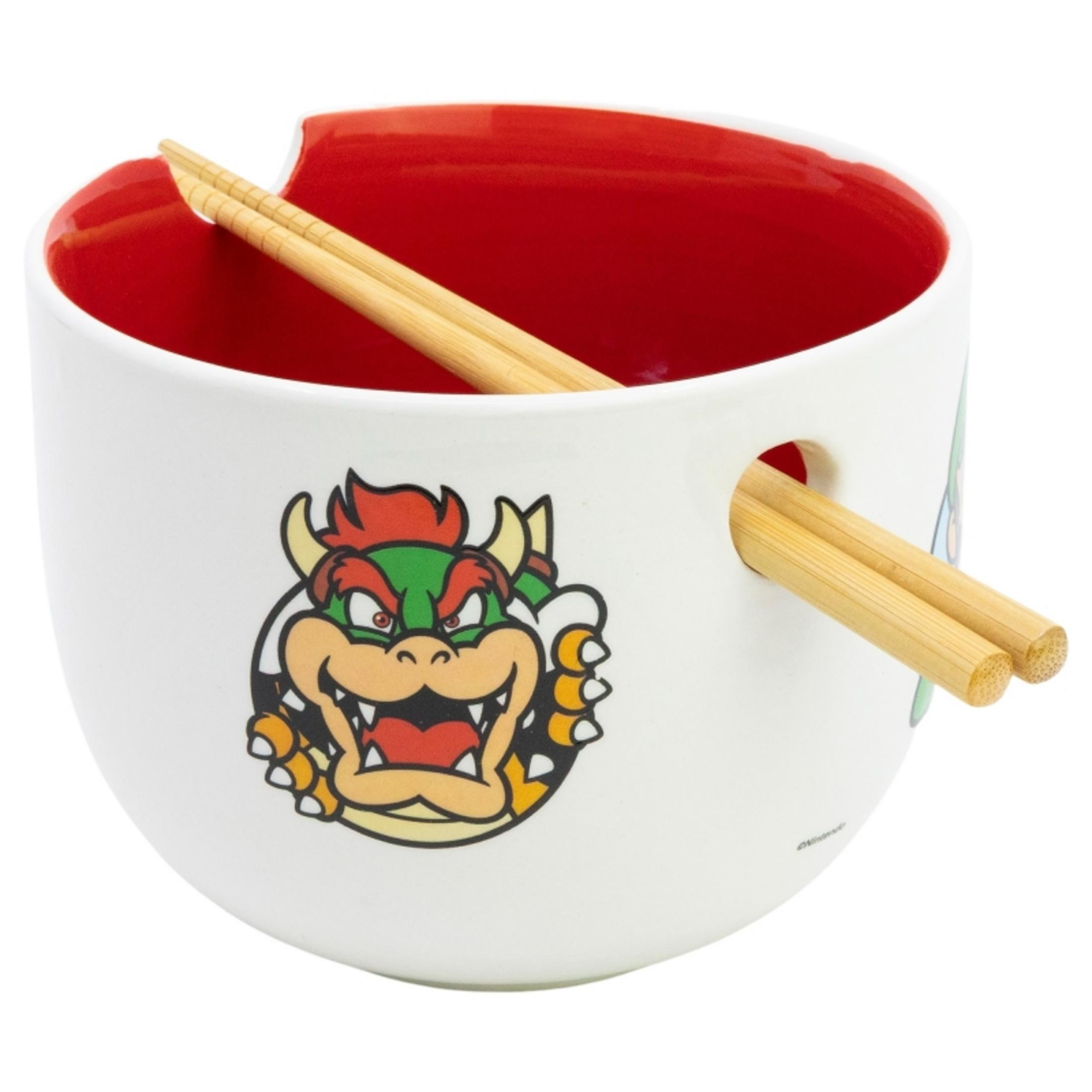 Cuenco blanco con diseño de Bowser y palillos de madera, interior rojo.