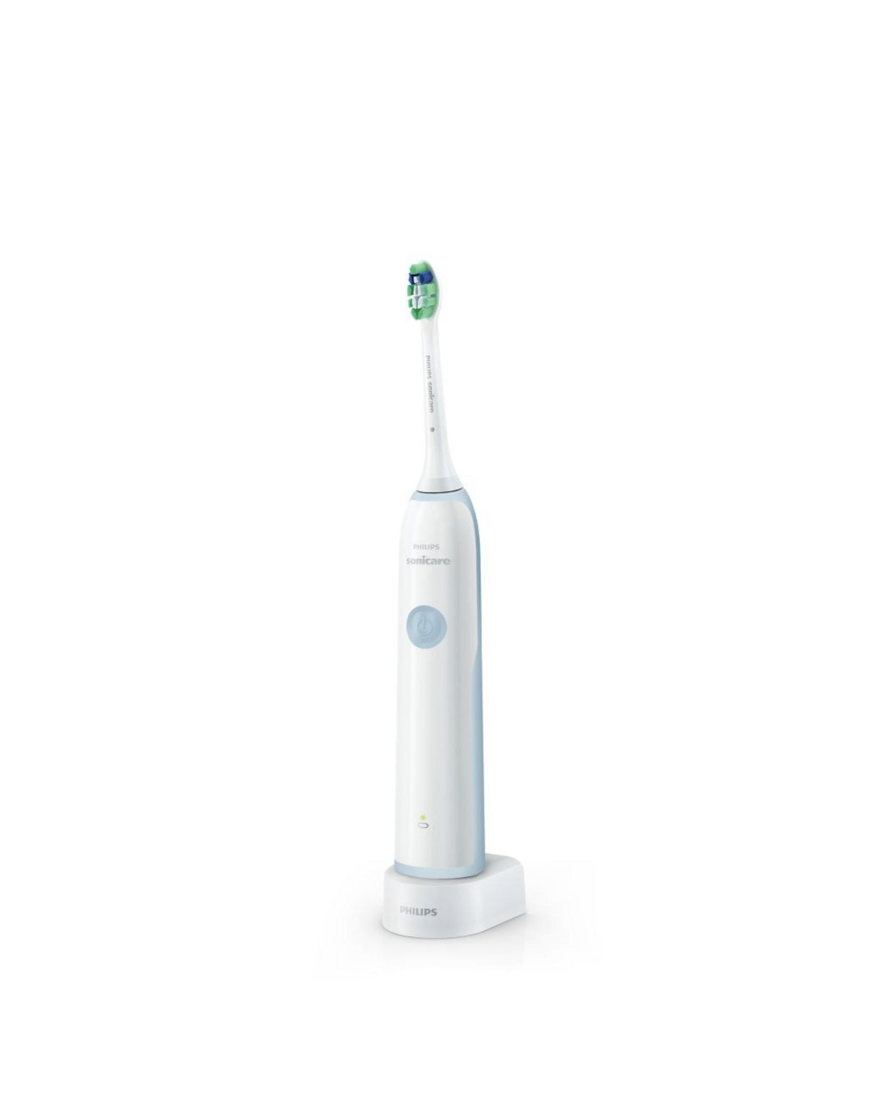 Un cepillo de dientes sónico blanco con acento azul en su base de carga.