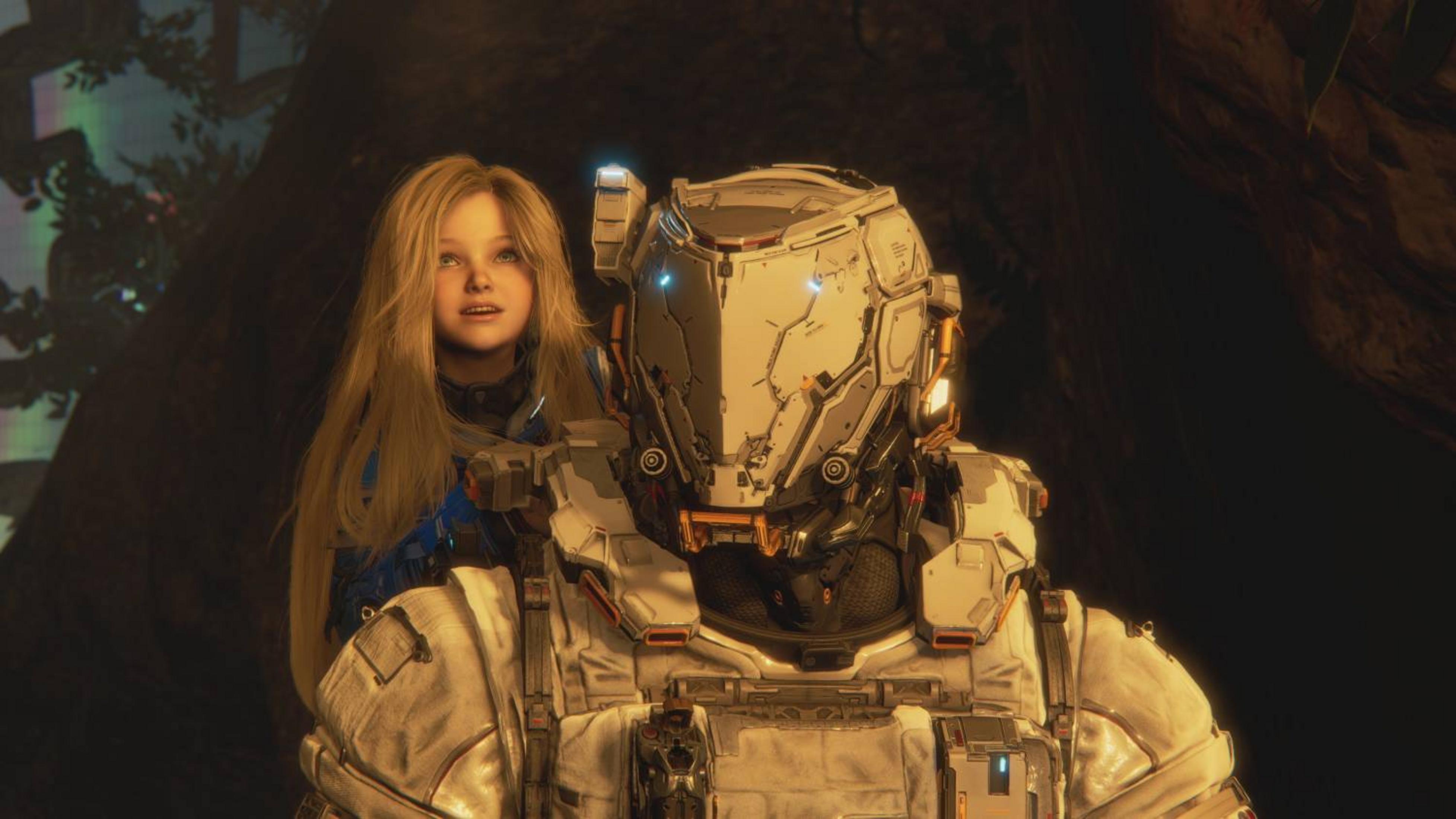 Un bambino biondo alza lo sguardo accanto a un astronauta in armatura bianca.
