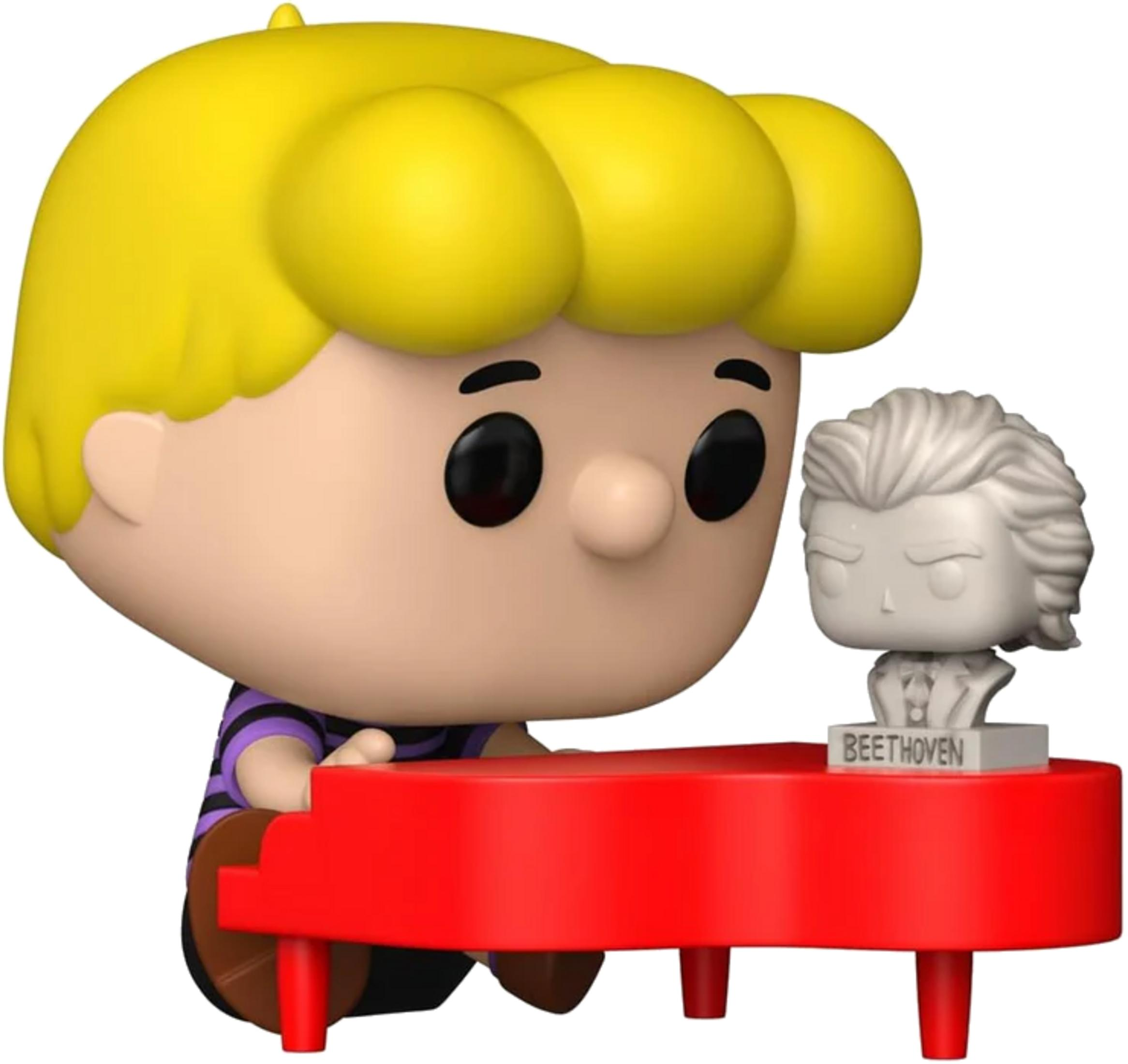 Un niño con pelo rubio toca un piano rojo frente a un busto de Beethoven.