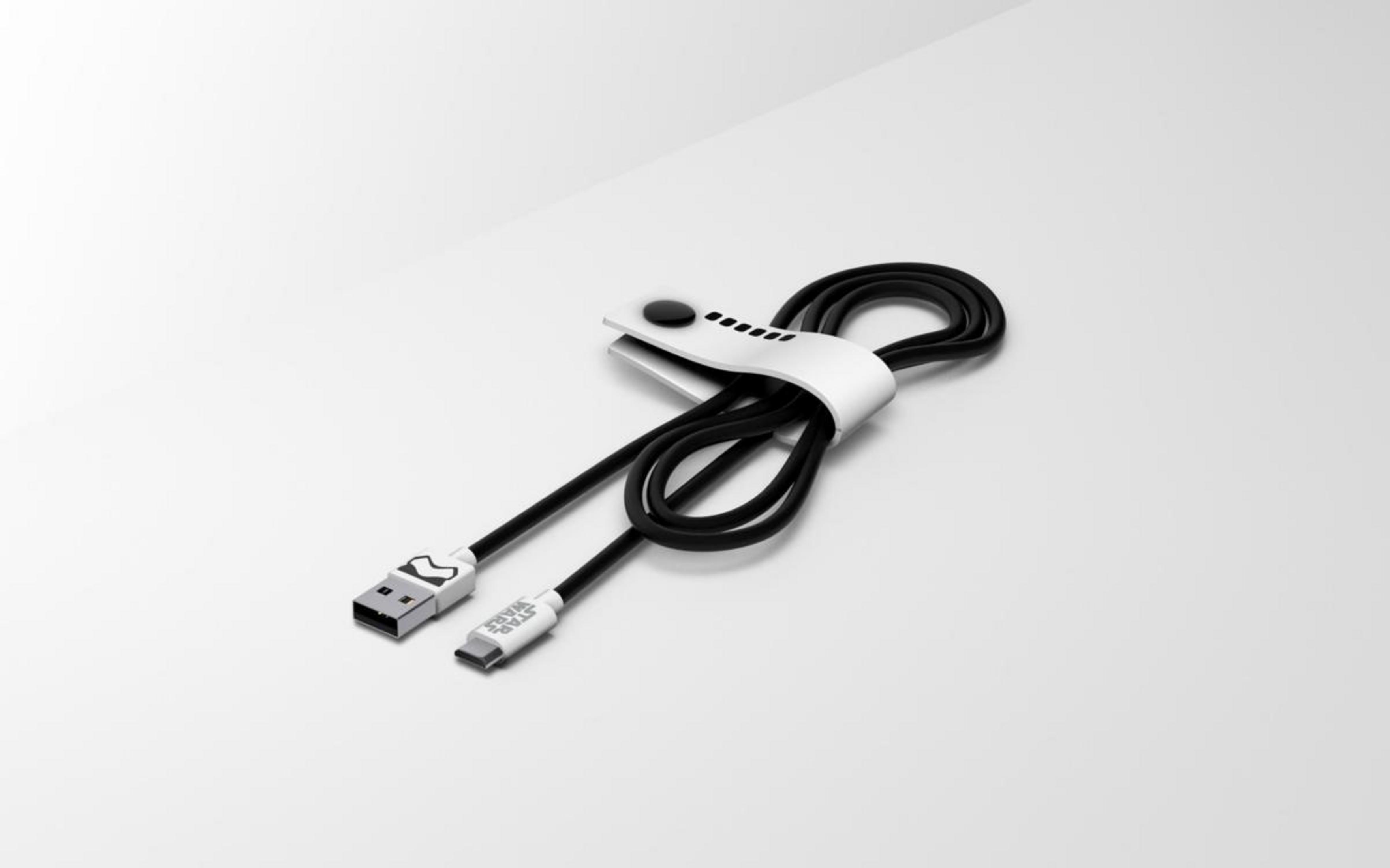 Un cavo USB-C nero Star Wars arrotolato con una cinghia bianca.