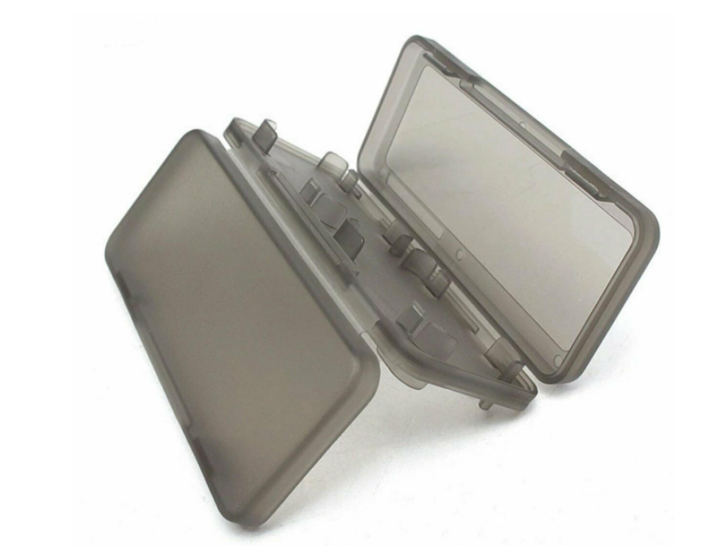 Un portatarjetas de juego gris transparente está abierto, mostrando ranuras.