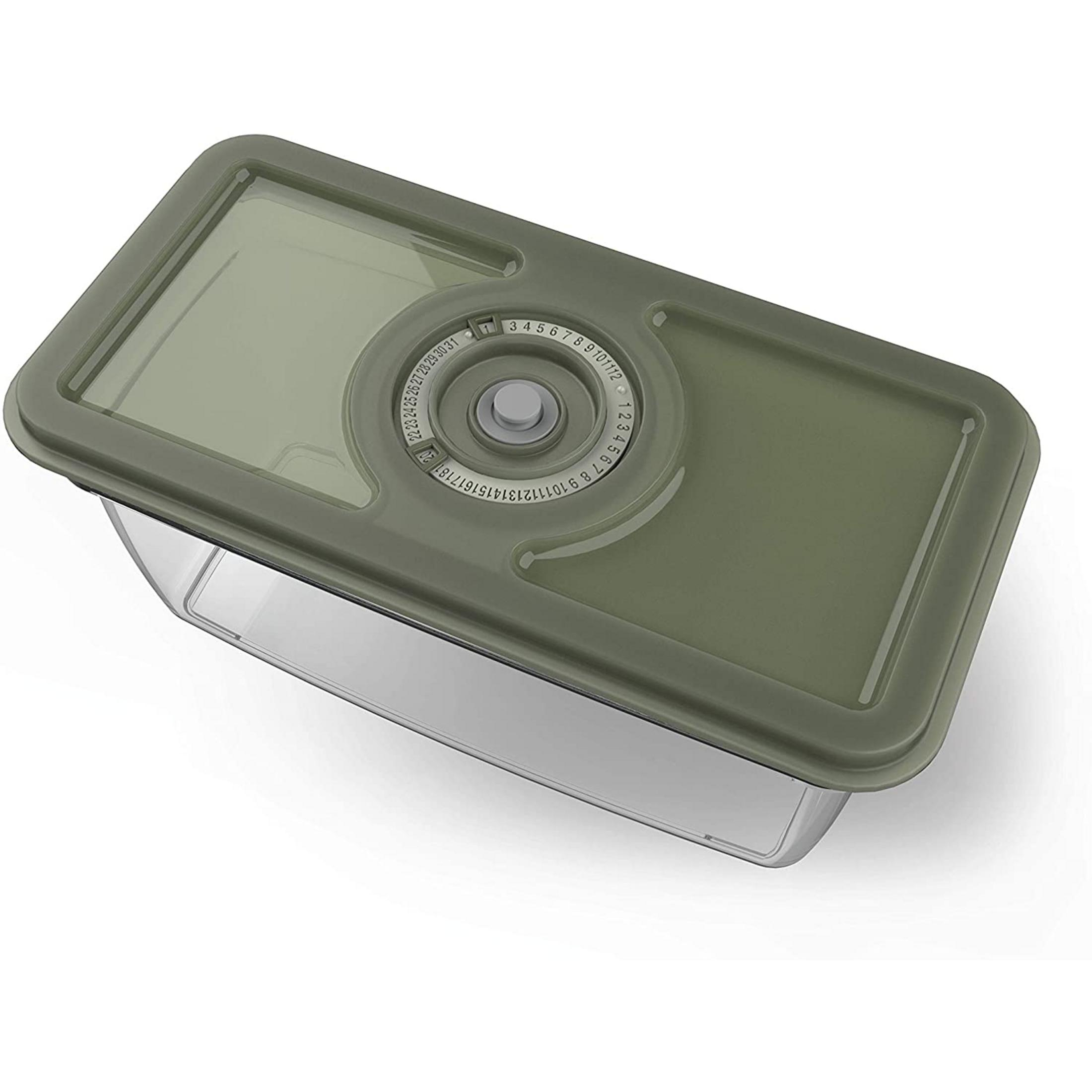 Contenedor transparente con tapa verde y dial de fecha.