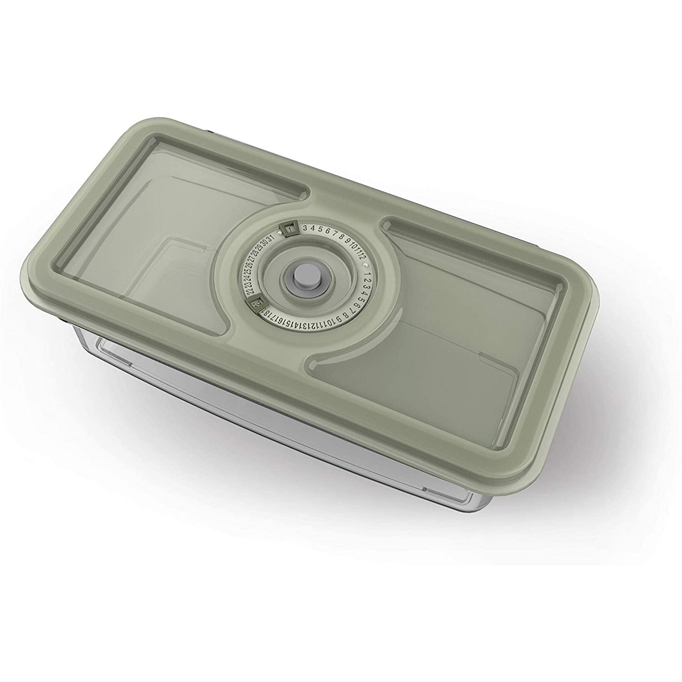 Un recipiente rectangular transparente para alimentos con tapa color crema y dial de fecha.