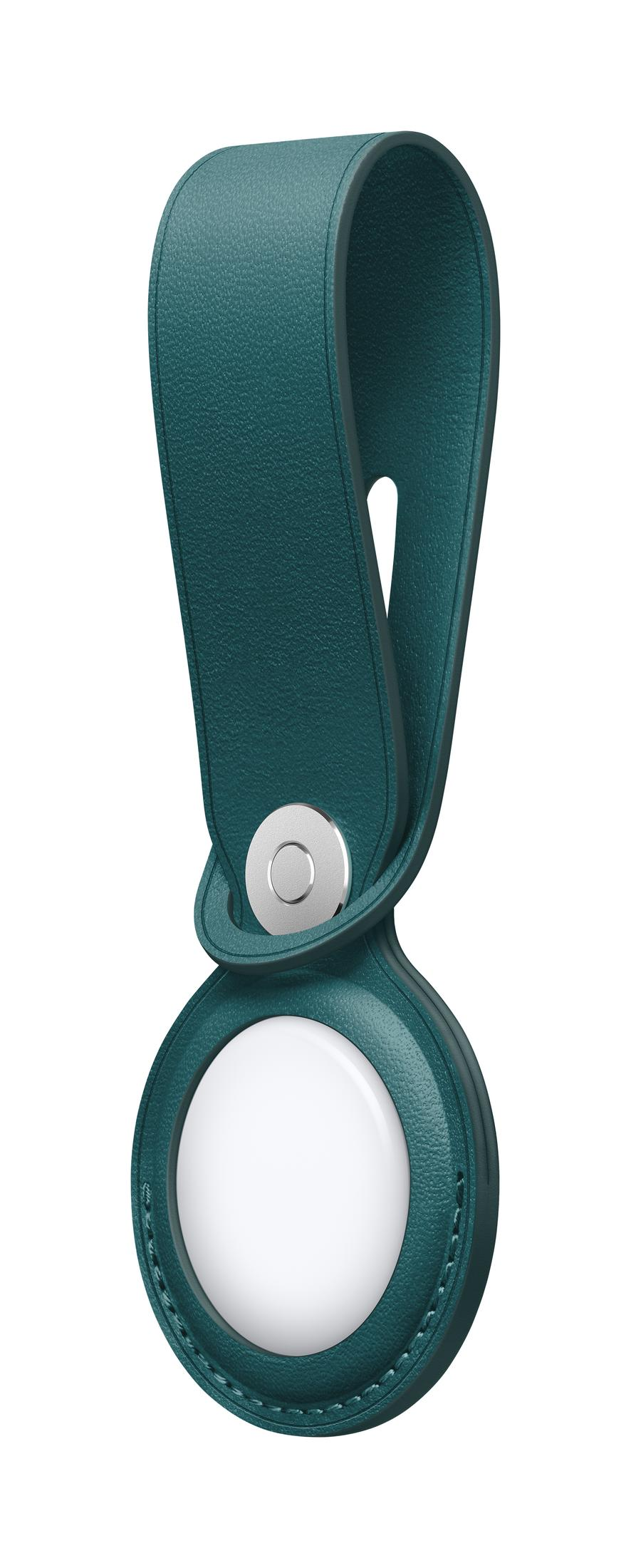 Un anello in pelle verde acqua scuro che tiene un oggetto circolare bianco.