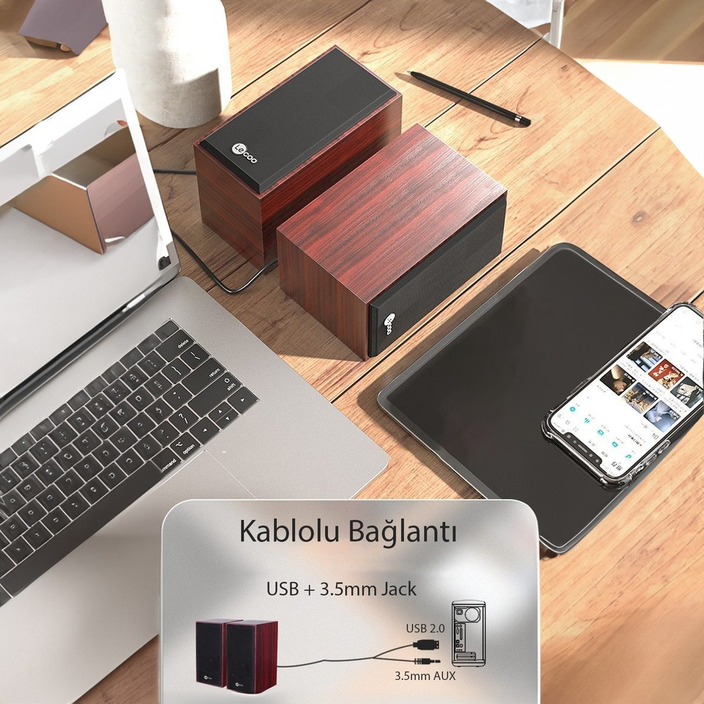 Laptop, tablet ve telefon yanında iki ahşap hoparlör, bağlantı şeması ile.