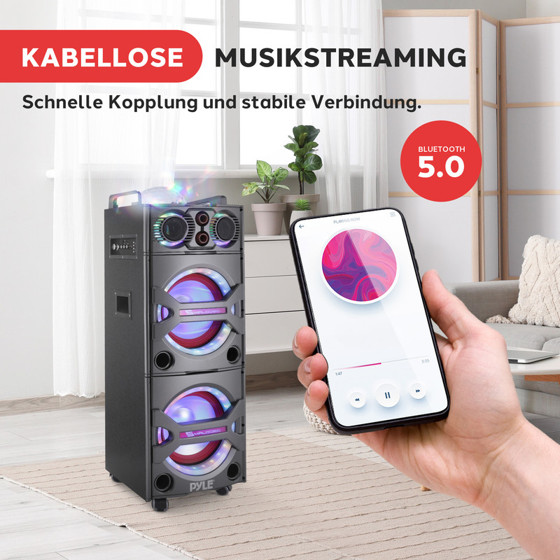 Ein schwarzer Lautsprecher mit Lichtern neben einem Smartphone, das Musik wiedergibt.