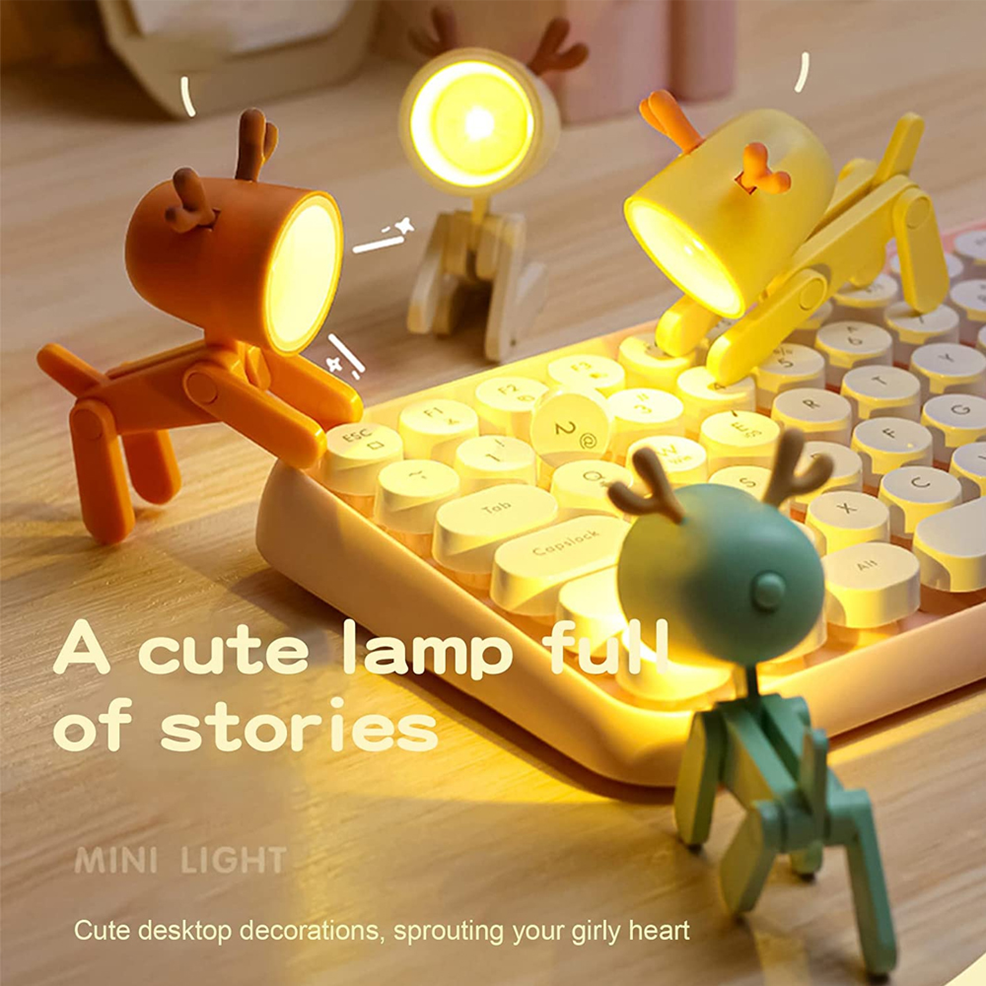 Drei niedliche Lampen in Tierform stehen auf einer Tastatur.