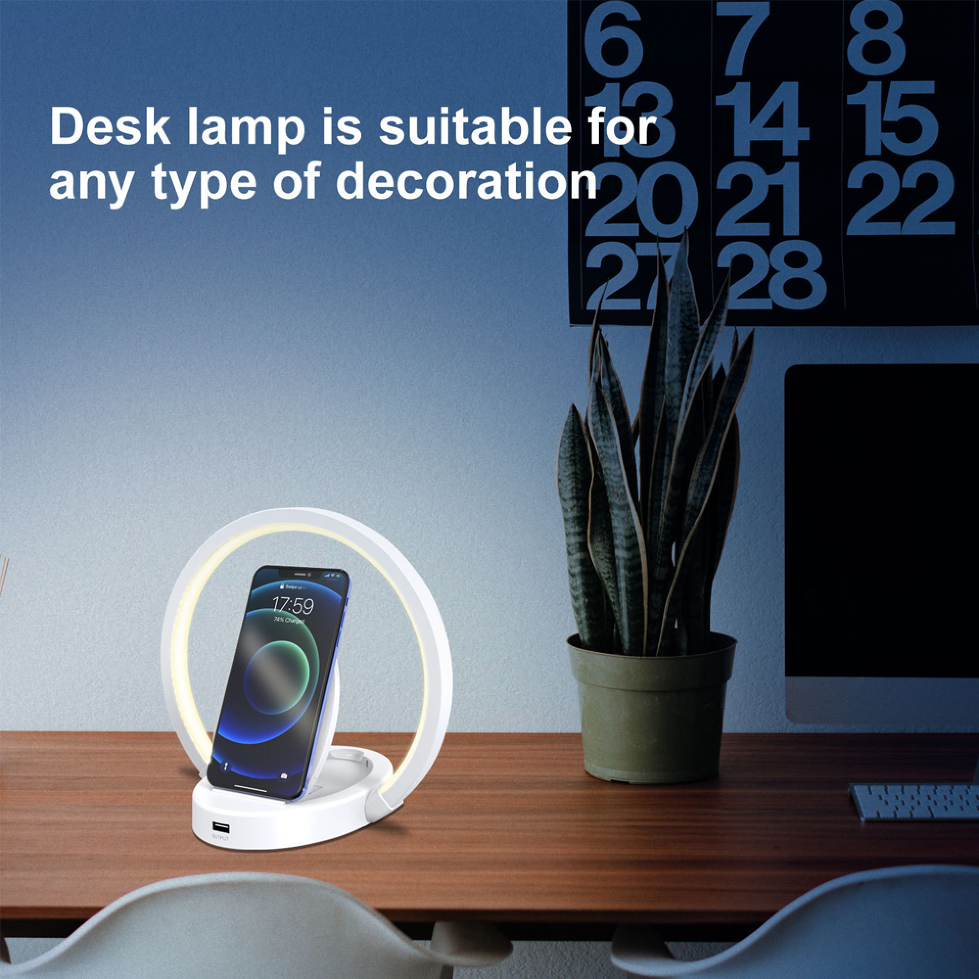 Moderner Schreibtisch mit Lampe, Handy und Pflanze.