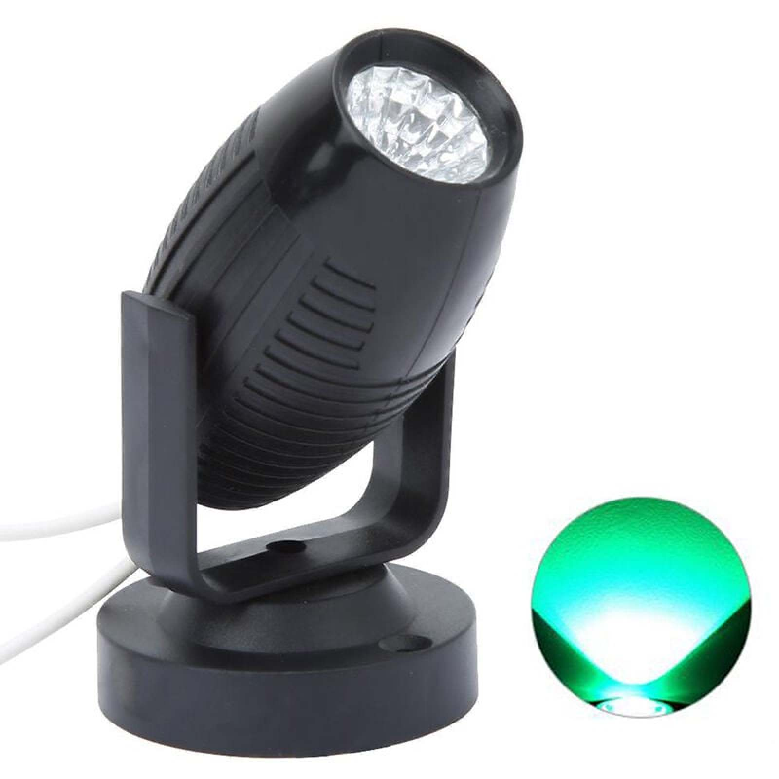 Schwarzer LED-Strahler mit weißem Kabel und grünem Lichtkreis daneben.
