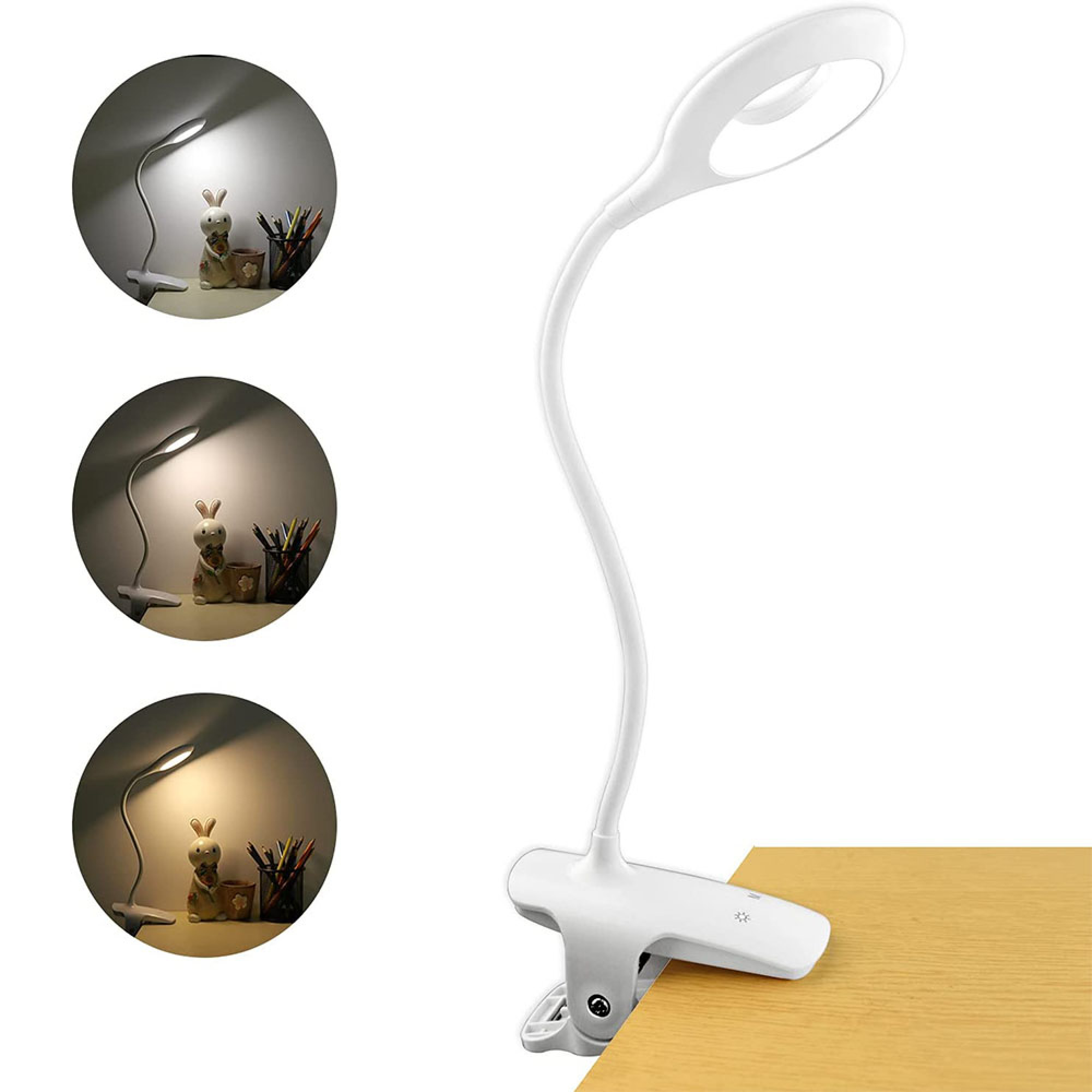 Eine weiße Klemmlampe mit Schwanenhals leuchtet auf einem Holzschreibtisch.