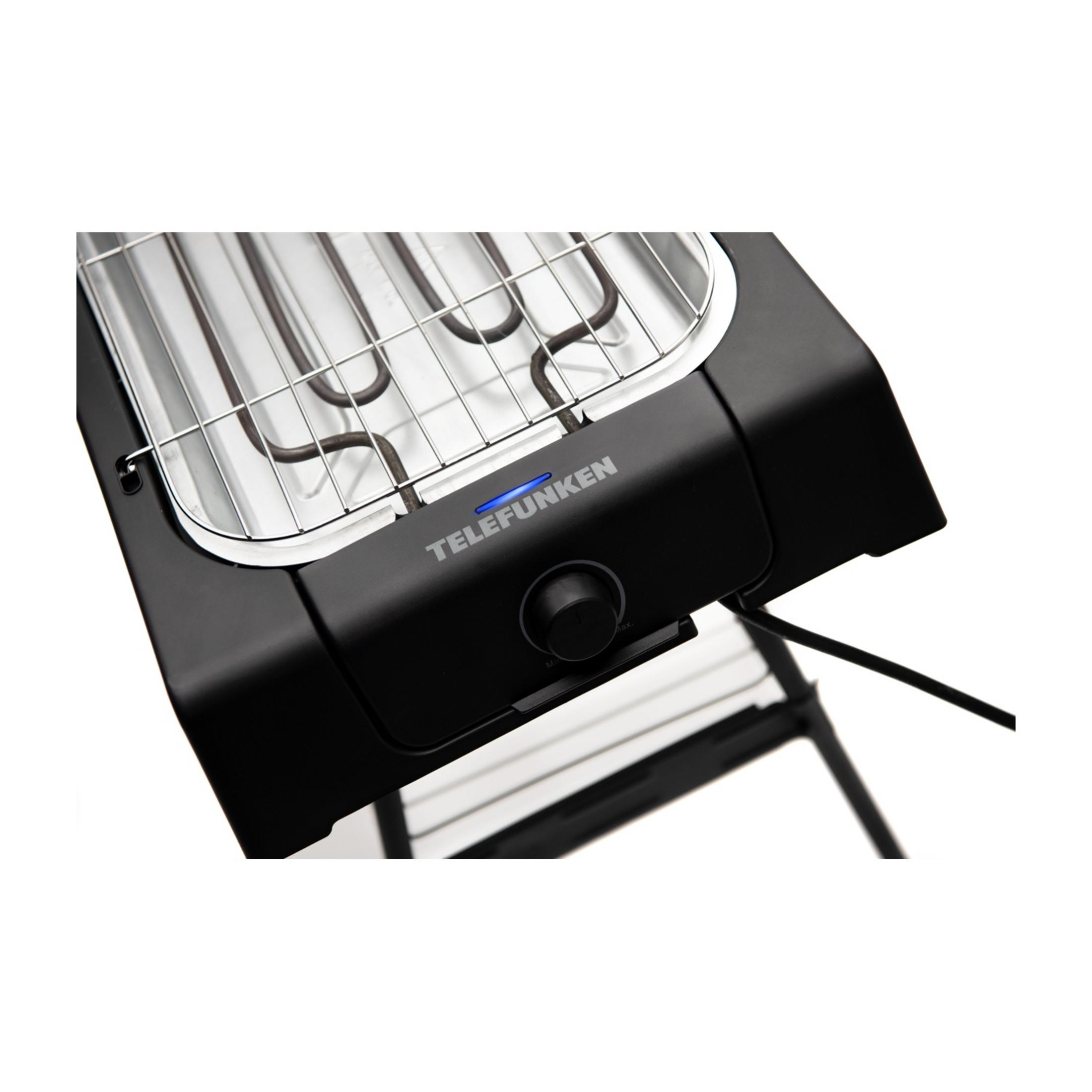Una griglia elettrica Telefunken nera con griglia cromata e spia blu.