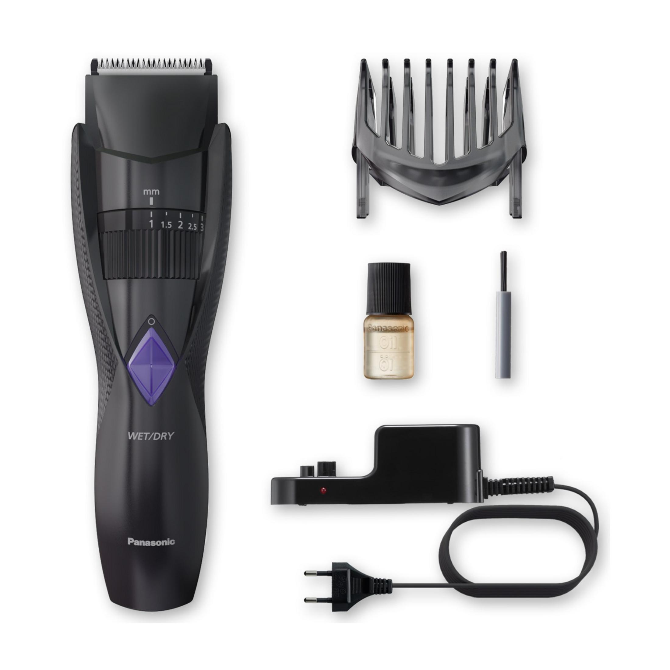 Una cortapelos negra con accesorios: protector de cuchilla, aceite, cable y base de carga.