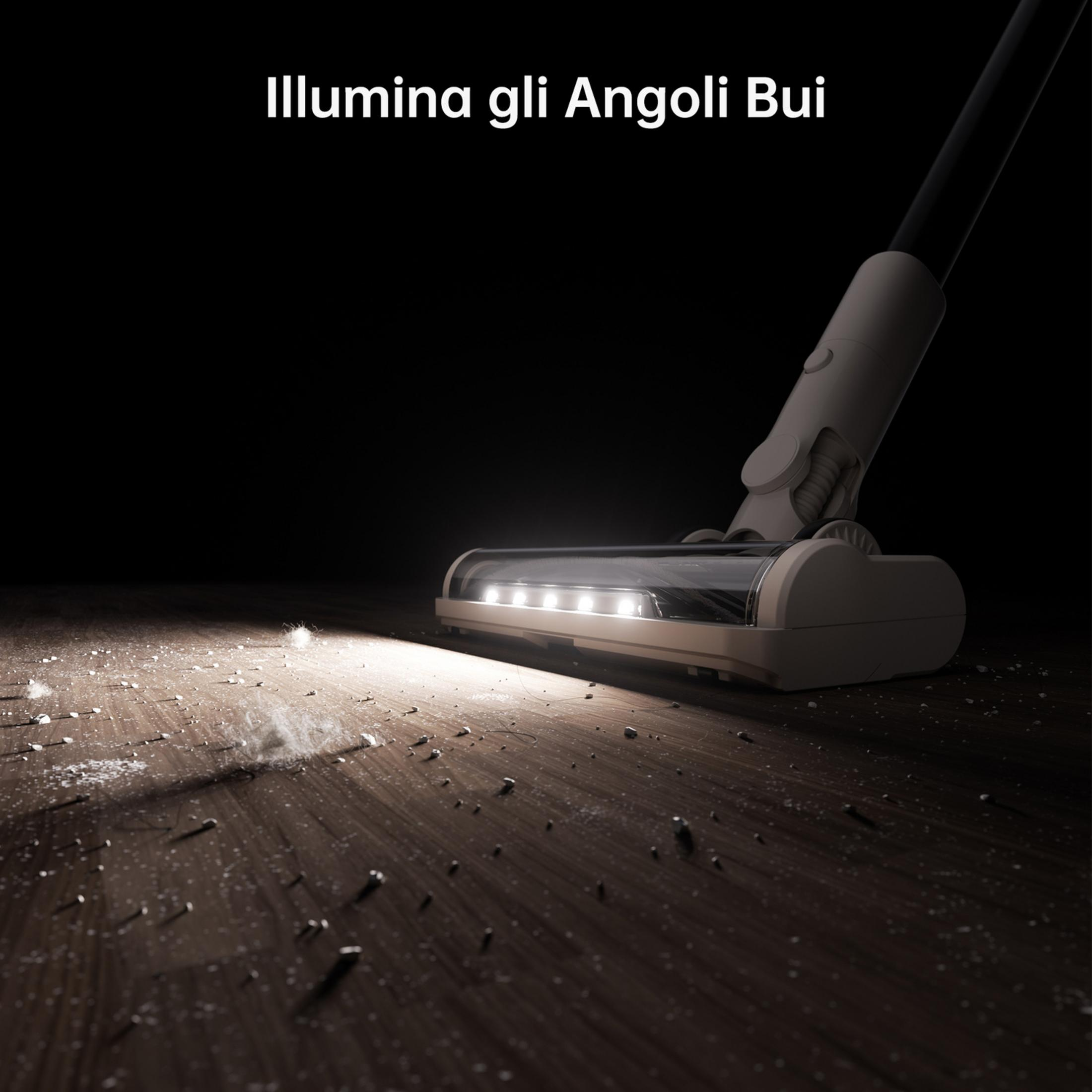 Un aspirapolvere con luci illumina lo sporco su un pavimento in legno.