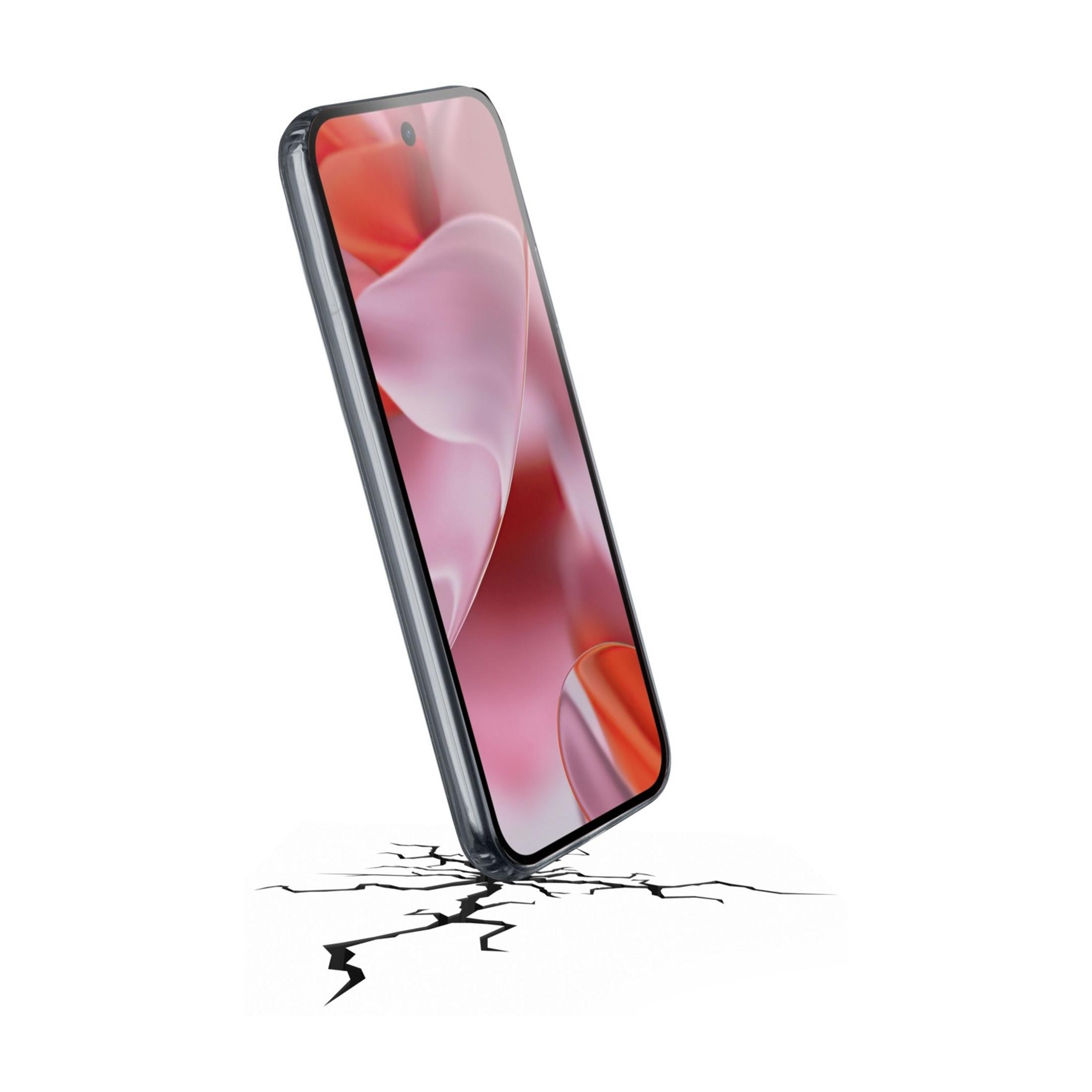 Uno smartphone si ribalta, creando crepe su una superficie bianca.