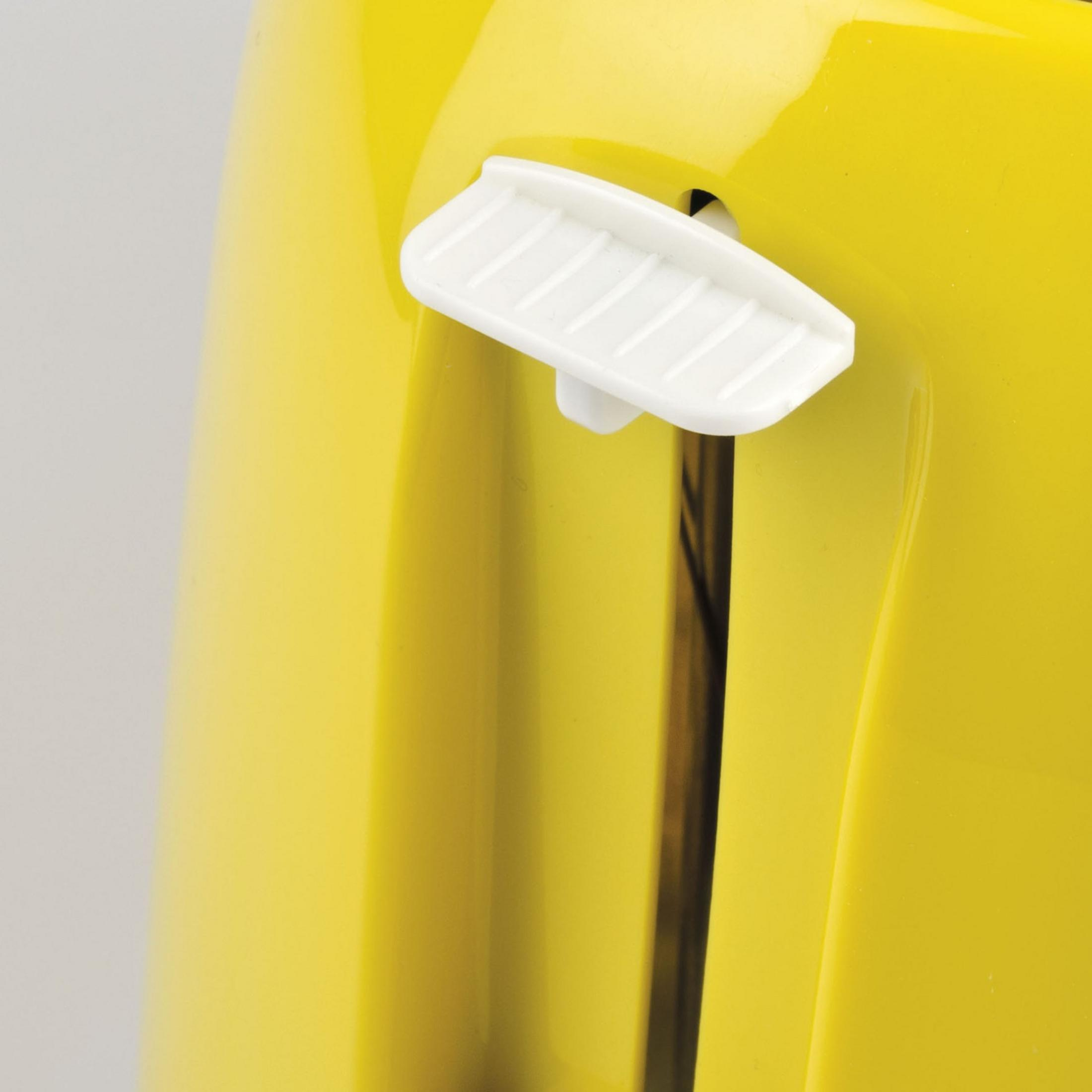 Ein Nahaufnahme einer gelben Toaster-Oberfläche mit einem weißen Hebel.