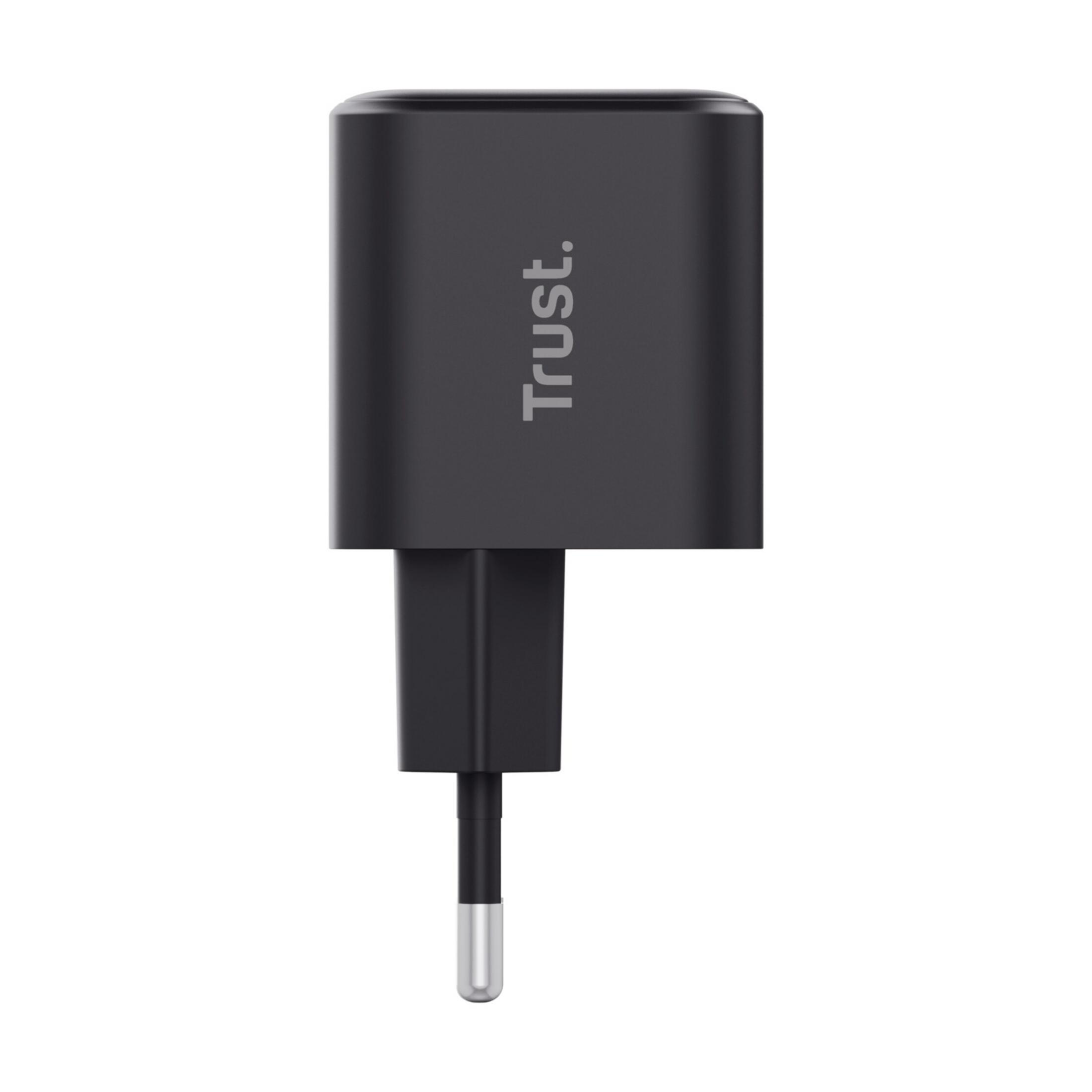 Un adaptateur secteur noir avec le logo « Trust. »