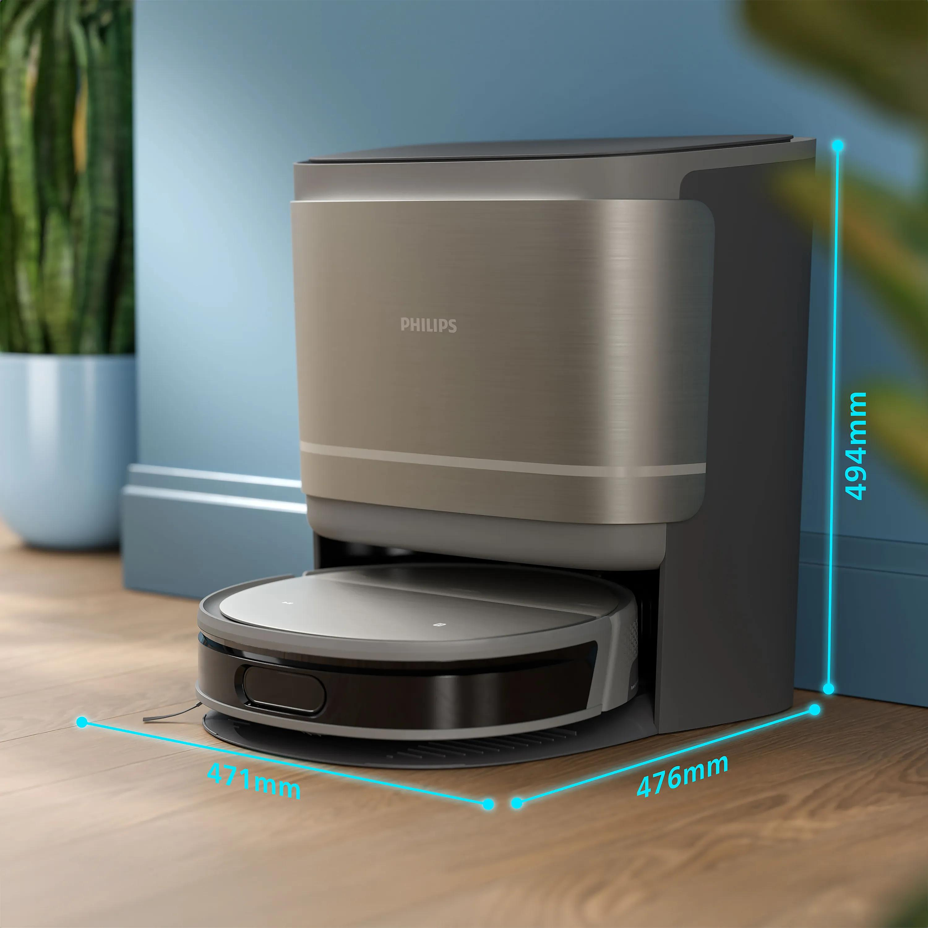 Boyutları gösterilen bir şarj istasyonundaki Philips robot süpürge.
