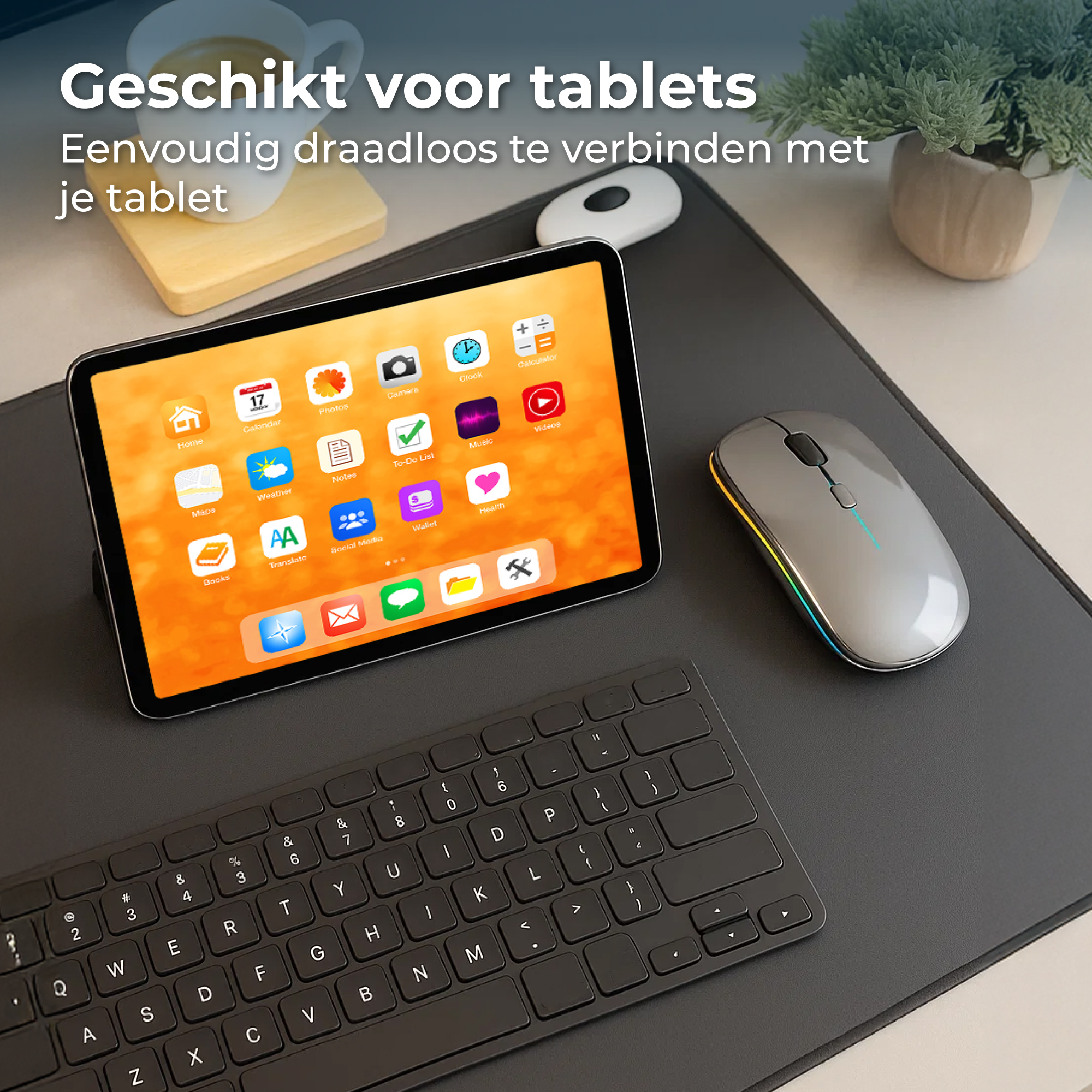 Tablet met toetsenbord, muis en kop koffie. Apps op het tabletscherm.