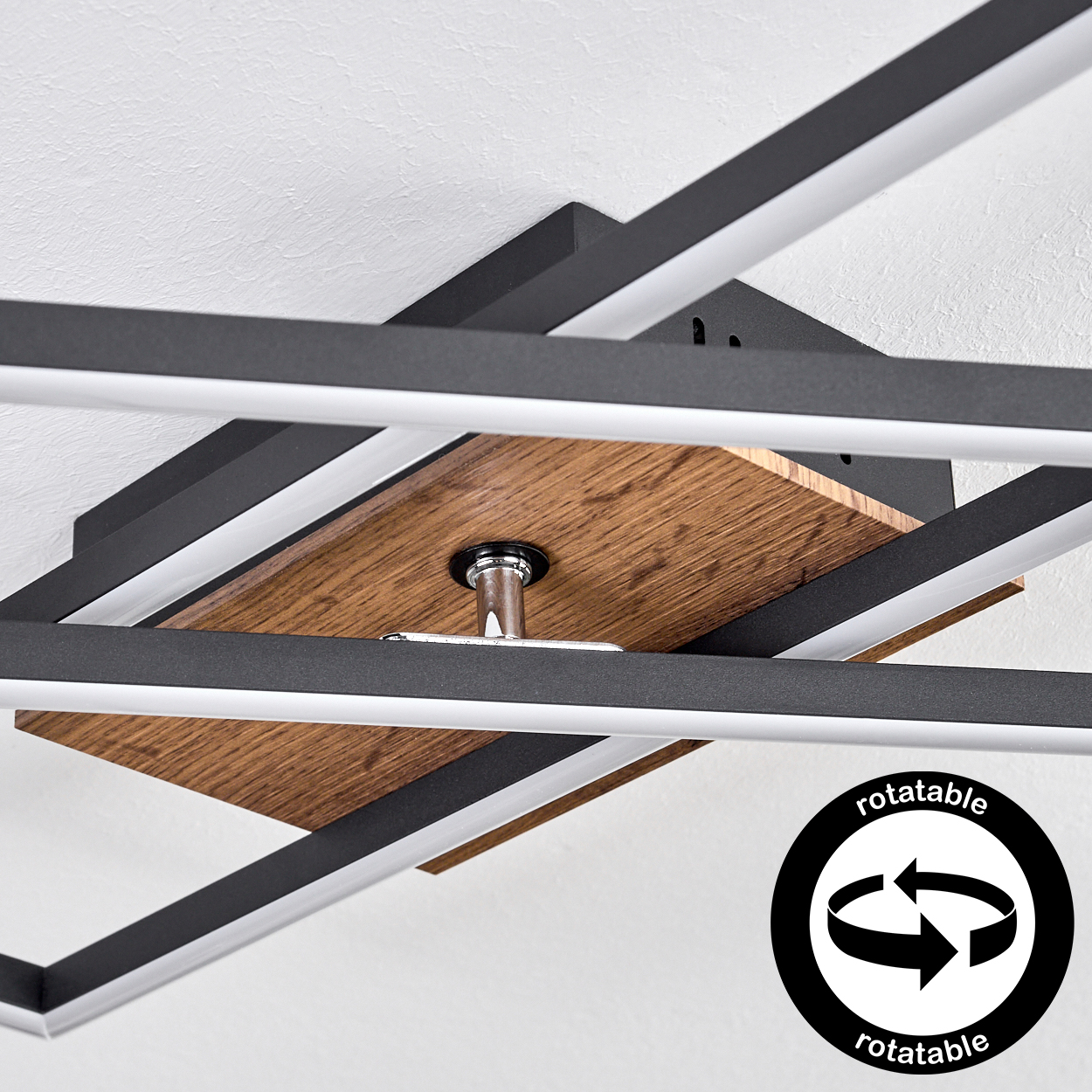 Moderne Deckenleuchte mit Holzmitte und rotierbaren schwarzen Rahmen.