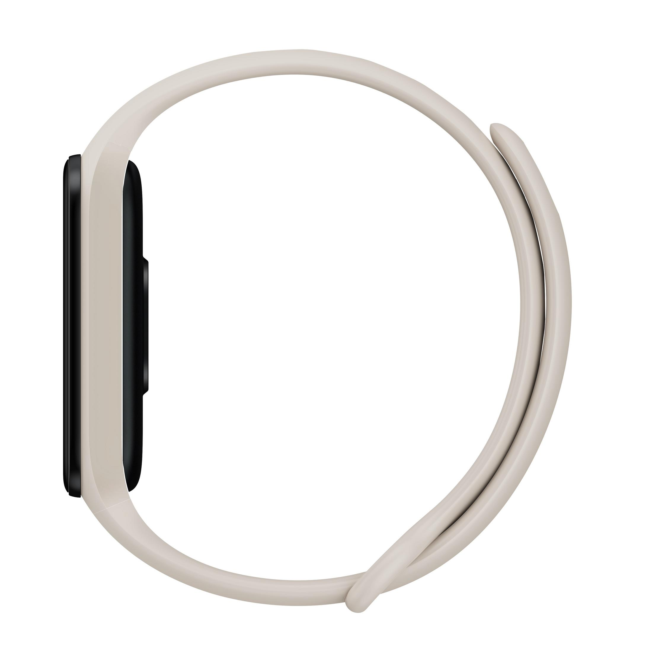 Una pulsera de actividad gris claro con pantalla negra, vista de lado.