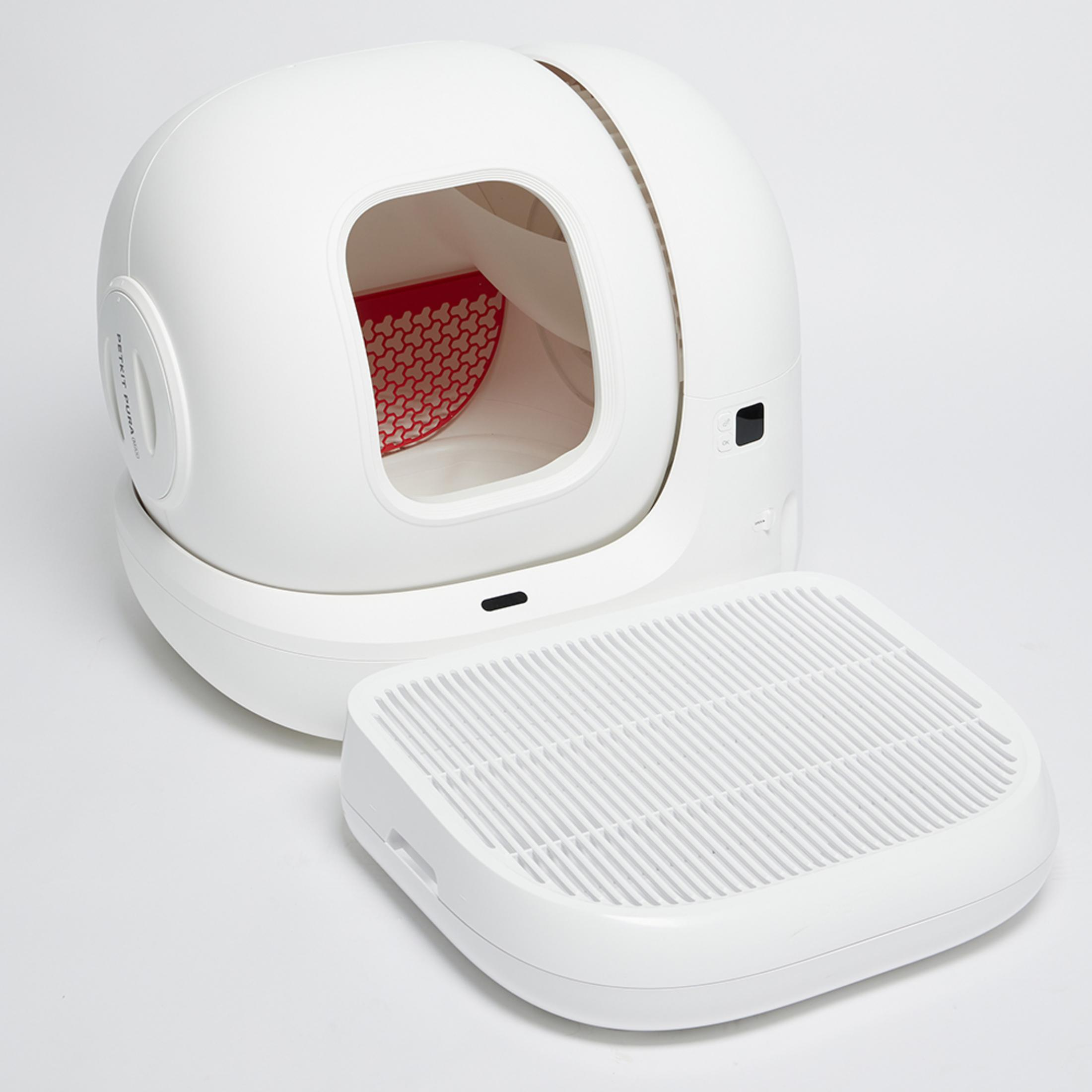 Un pulitore bianco e futuristico per lettiera con griglia rimovibile. Interno rosso visibile.