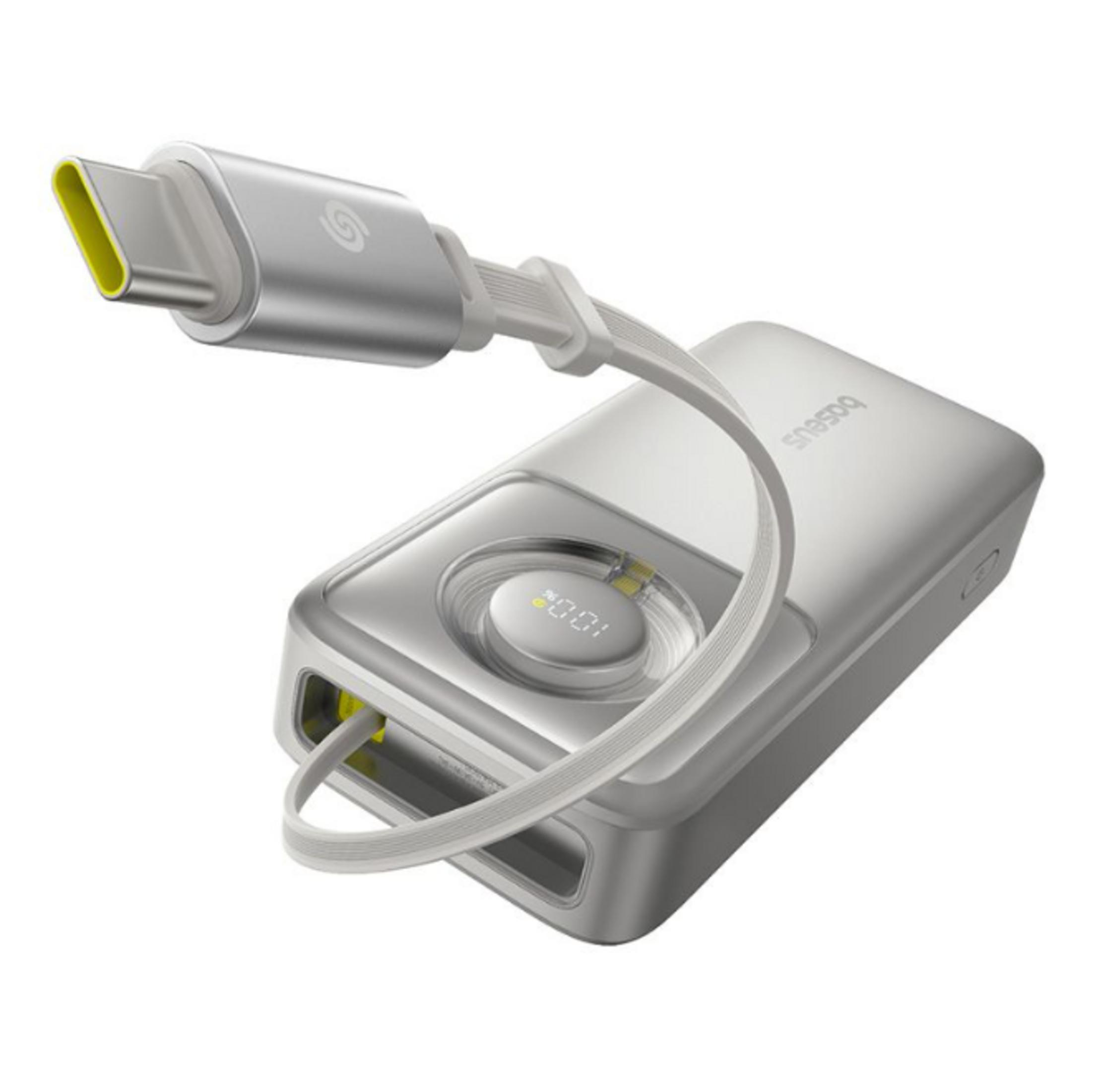 Una batería externa USB-C plateada con cable integrado y un indicador de carga del 100%.